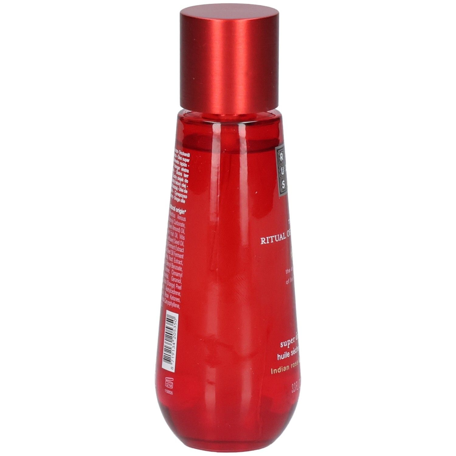 Rote Flasche mit rotem Verschluss, Rückseite mit Inhaltsstoffen und Barcode. RITUALS The Ritual of Ayurveda Super Dry Body Oil.