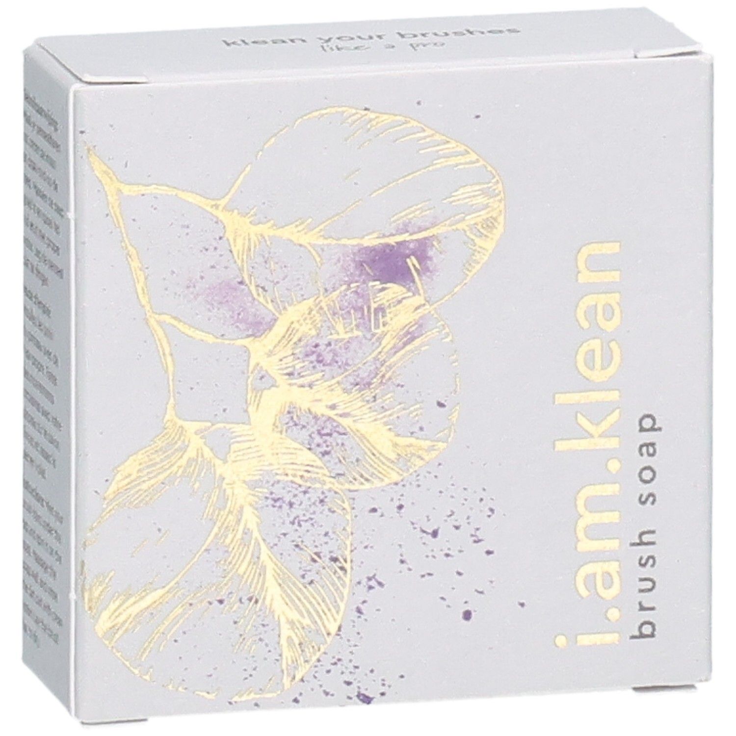 Kartonverpackung mit floralem Design und Produktnamen i.am.klean Brush Soap. Ansicht von schräg oben.