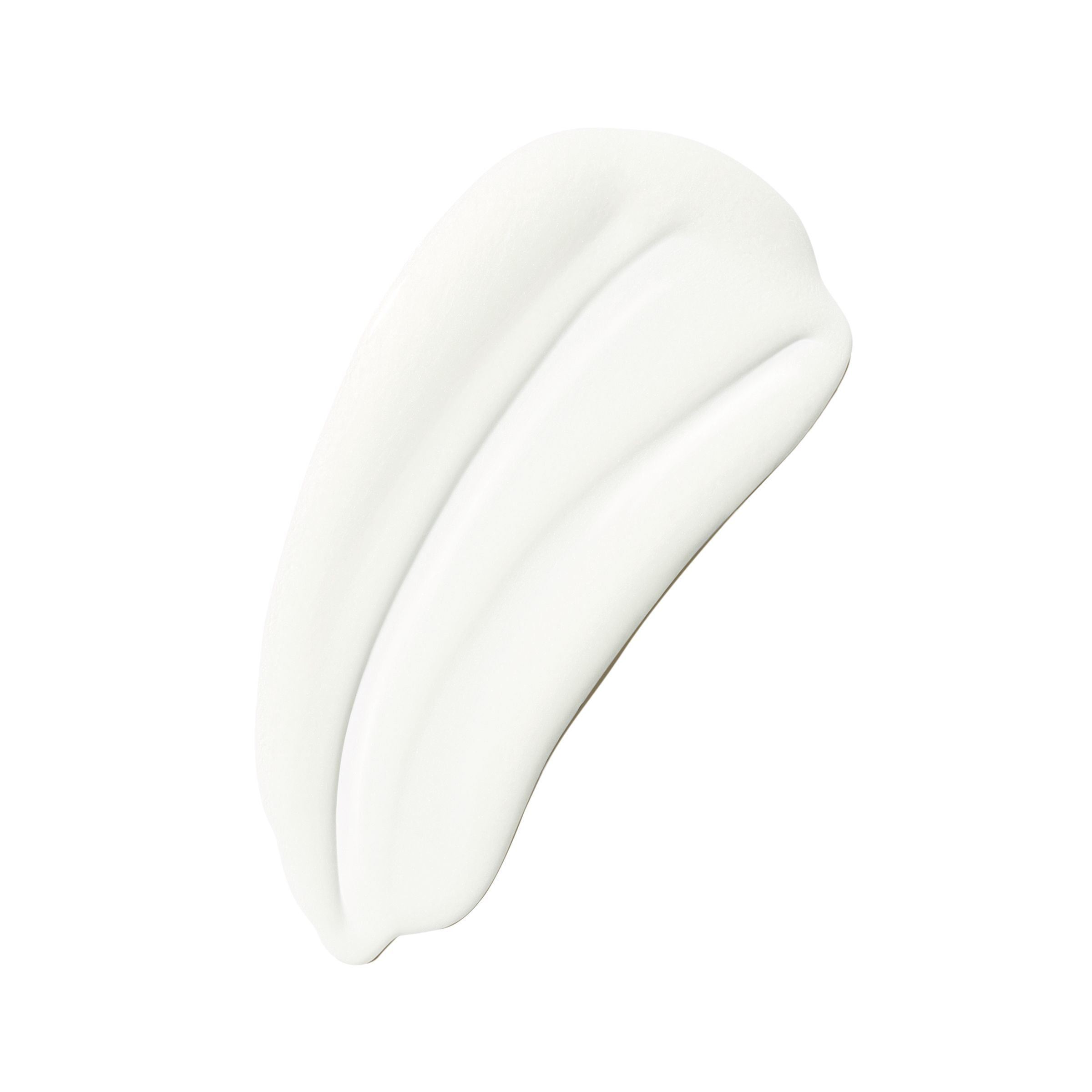 Une traînée de crème blanche sur fond blanc.