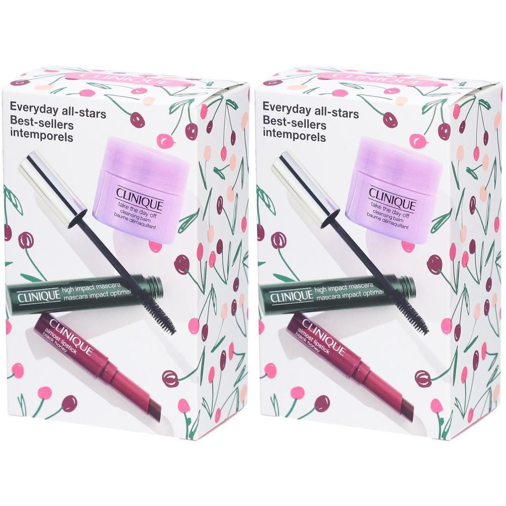 Clinique Kosmetik-Set mit Mascara, Lippenstift und Augencreme auf weißem Karton mit Kirschmuster.