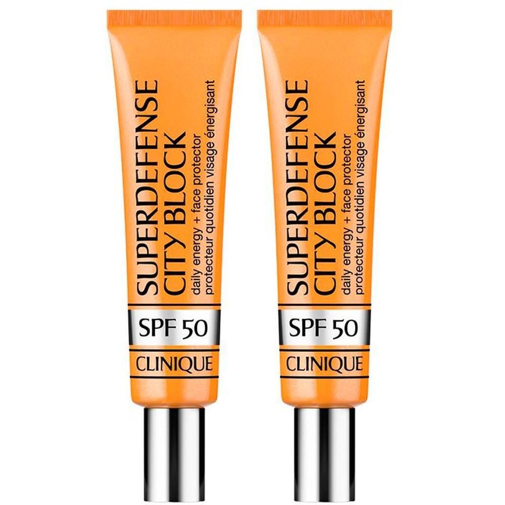 Deux tubes orange Clinique Superdefense City Block SPF 50 avec bouchons argentés.