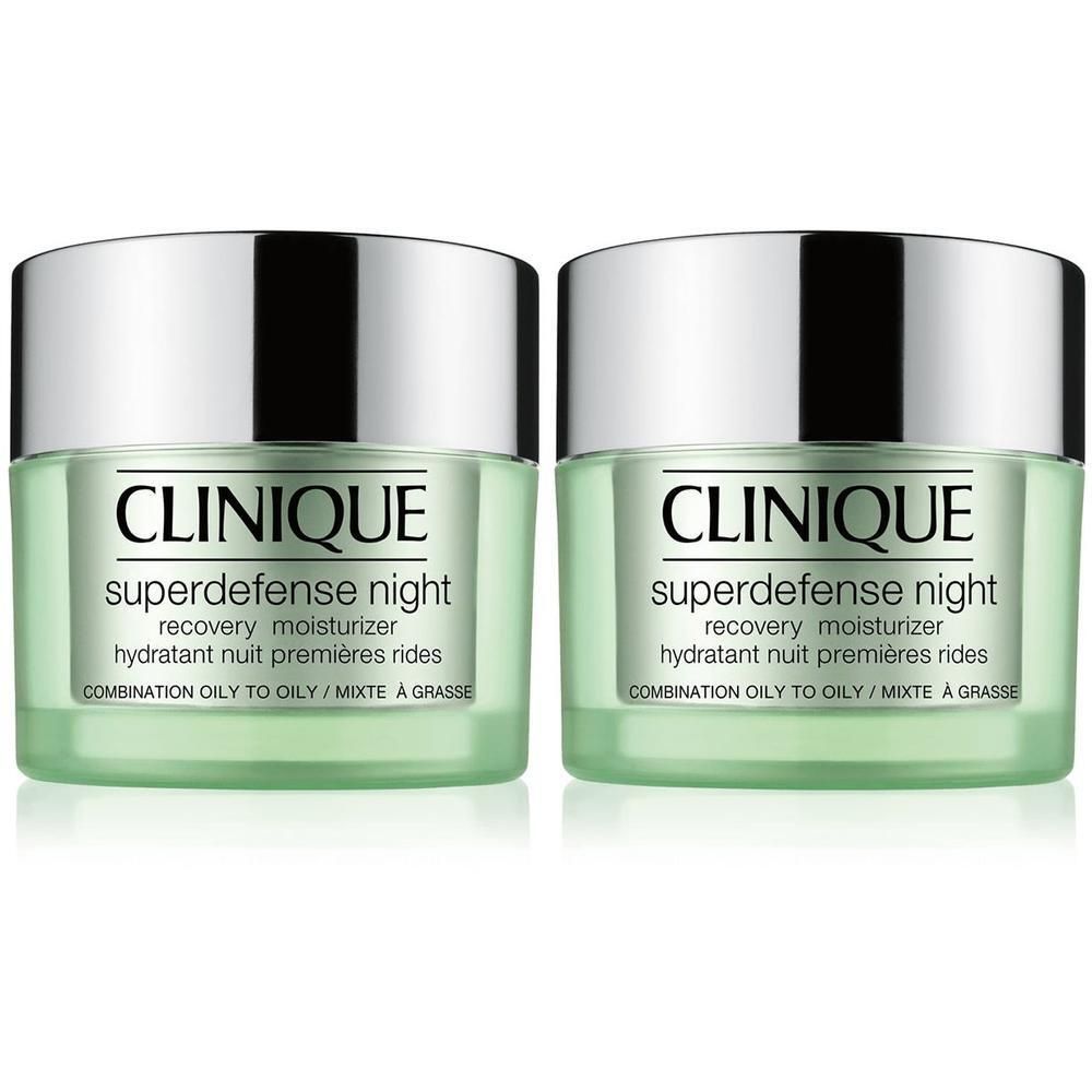 Deux pots de crème de nuit Clinique Superdefense avec couvercles argentés.