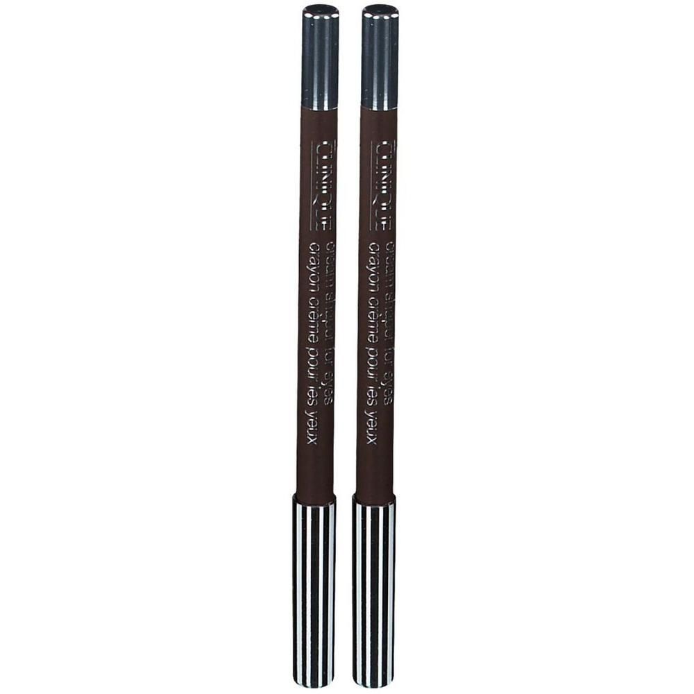 Deux crayons khôl marron avec capuchons argentés et extrémités rayées.