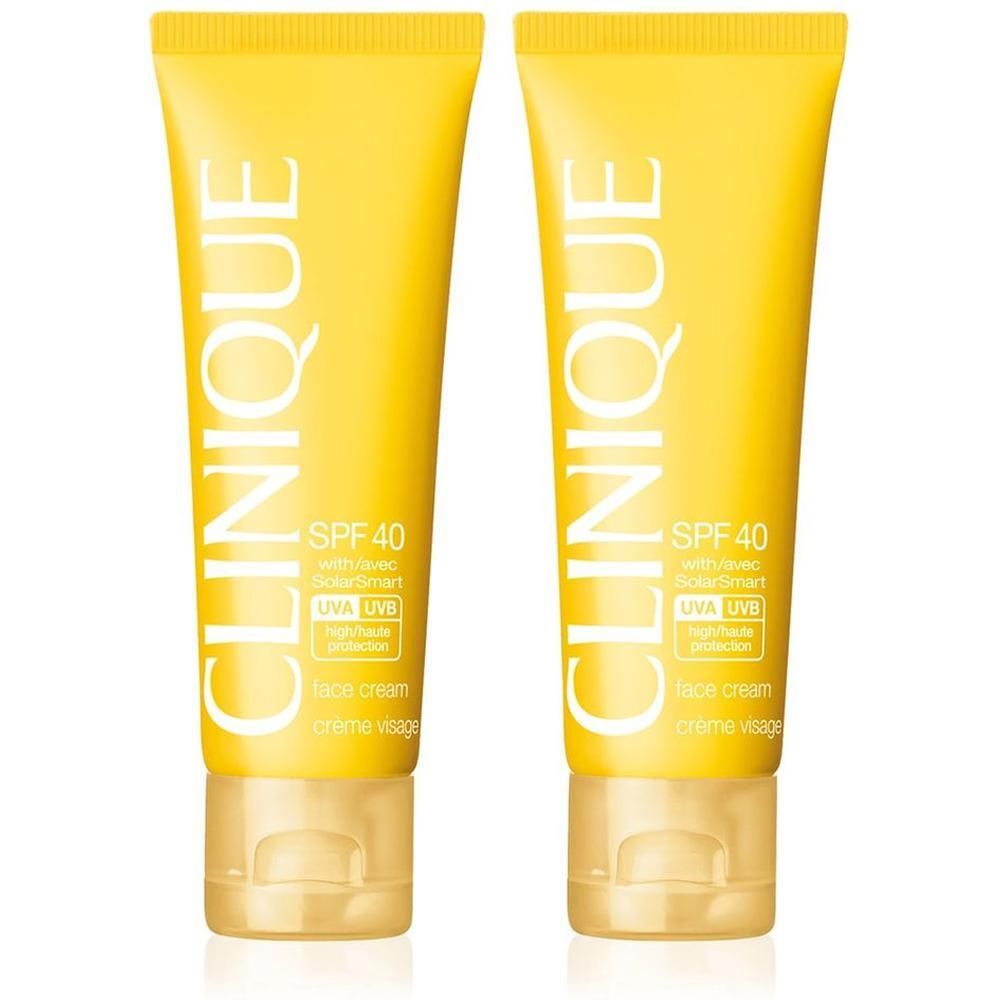 Zwei gelbe CLINIQUE Sonnenschutzcreme-Tuben mit SPF 40 für das Gesicht.