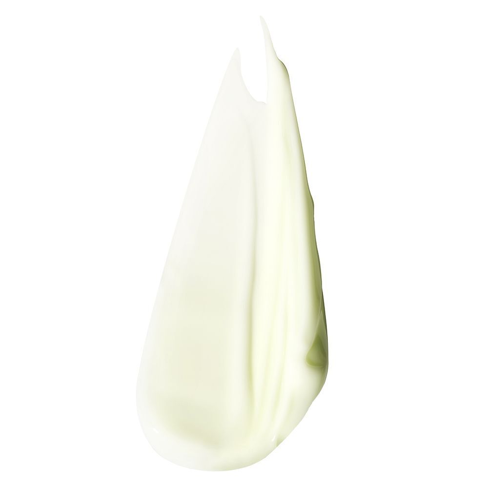 Eine hellgrüne, cremige Textur von CLINIQUE Redness Solutions Soothing Cleanser.