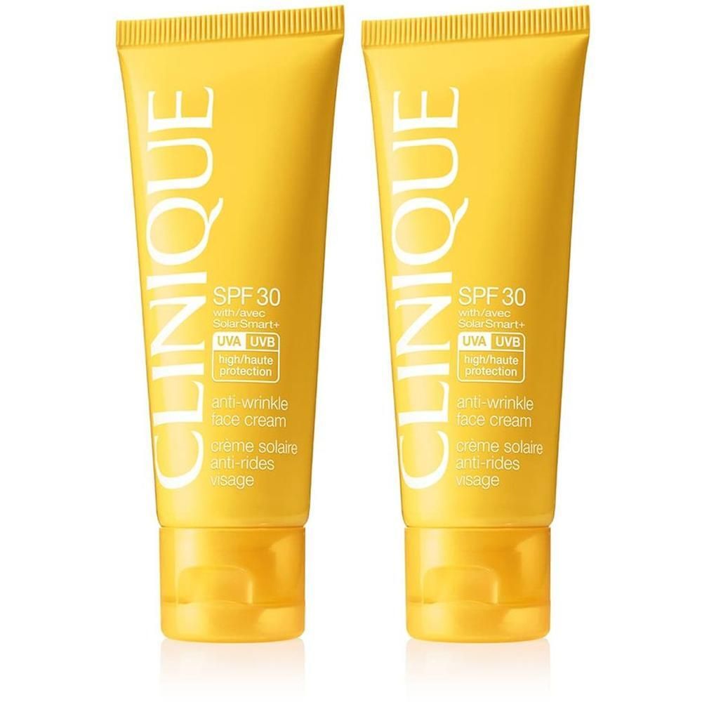 Deux tubes jaunes de crème solaire CLINIQUE SPF 30 avec formule anti-rides.