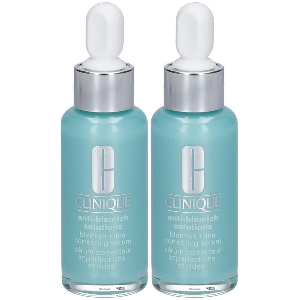 Deux sérums correcteurs Clinique Anti-Blemish dans des flacons turquoise avec compte-gouttes. Accents argentés et blancs.