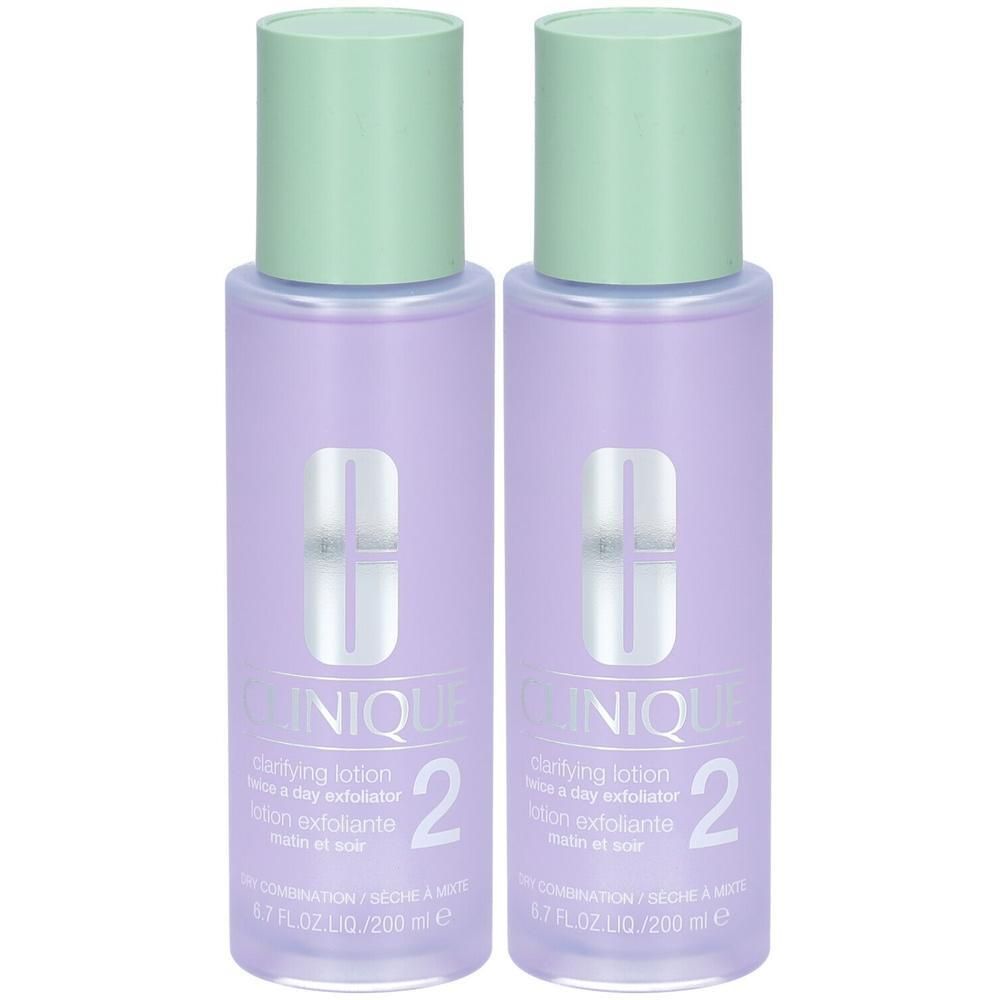 Deux flacons de CLINIQUE Clarifying Lotion 2, violets transparents, avec bouchons vert pâle. Lotion exfoliante pour peau sèche/mixte.