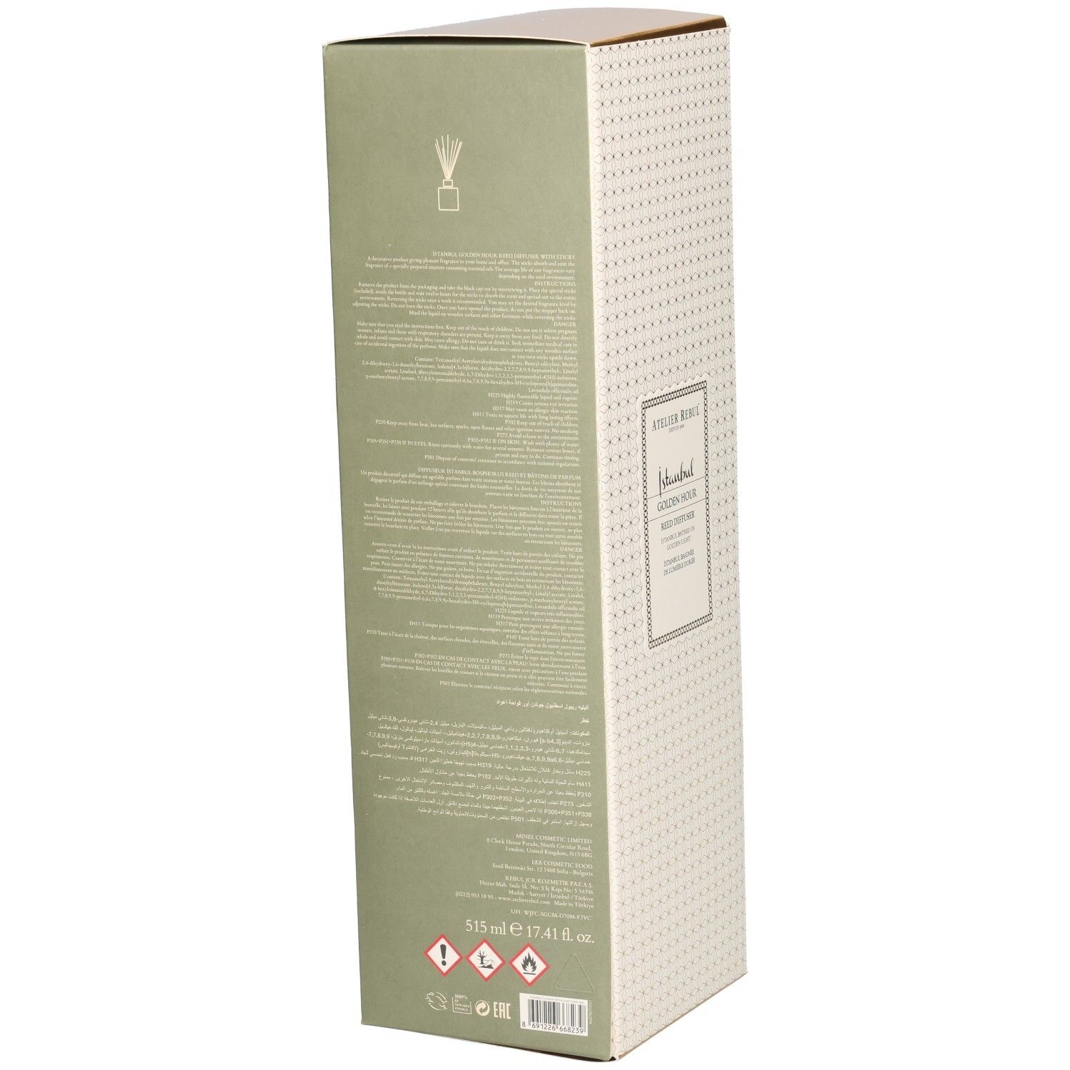 Boîte rectangulaire haute. Dos avec texte et symboles. Beige avec motif doré et côtés verts.