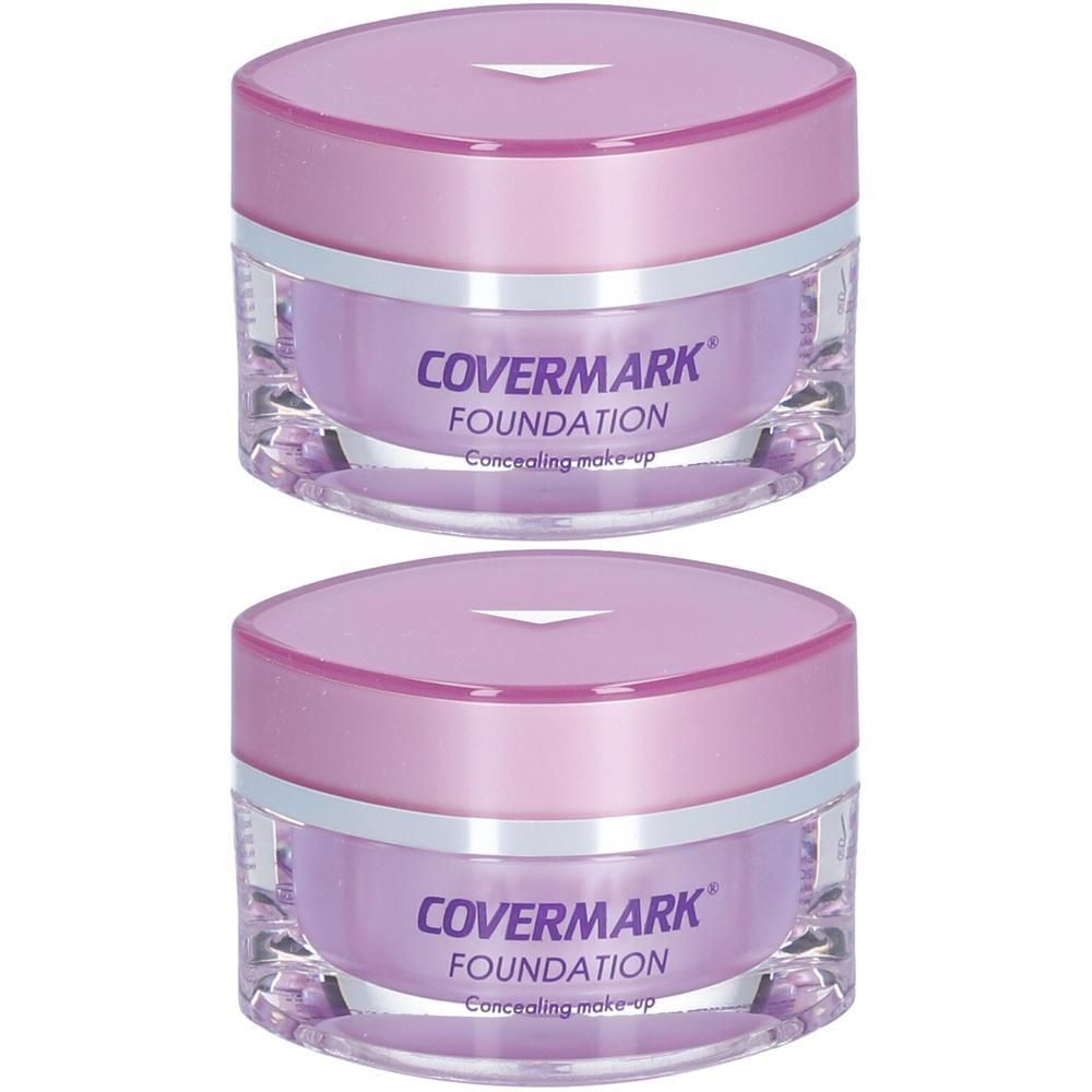 Zwei COVERMARK Foundation Concealing Make-up Tiegel mit lila Deckel und klarem Behälter.