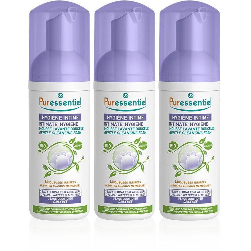 Drei Flaschen Puressentiel Intimhygiene sanfter Waschschaum mit lila Pumpspendern und Kappen.