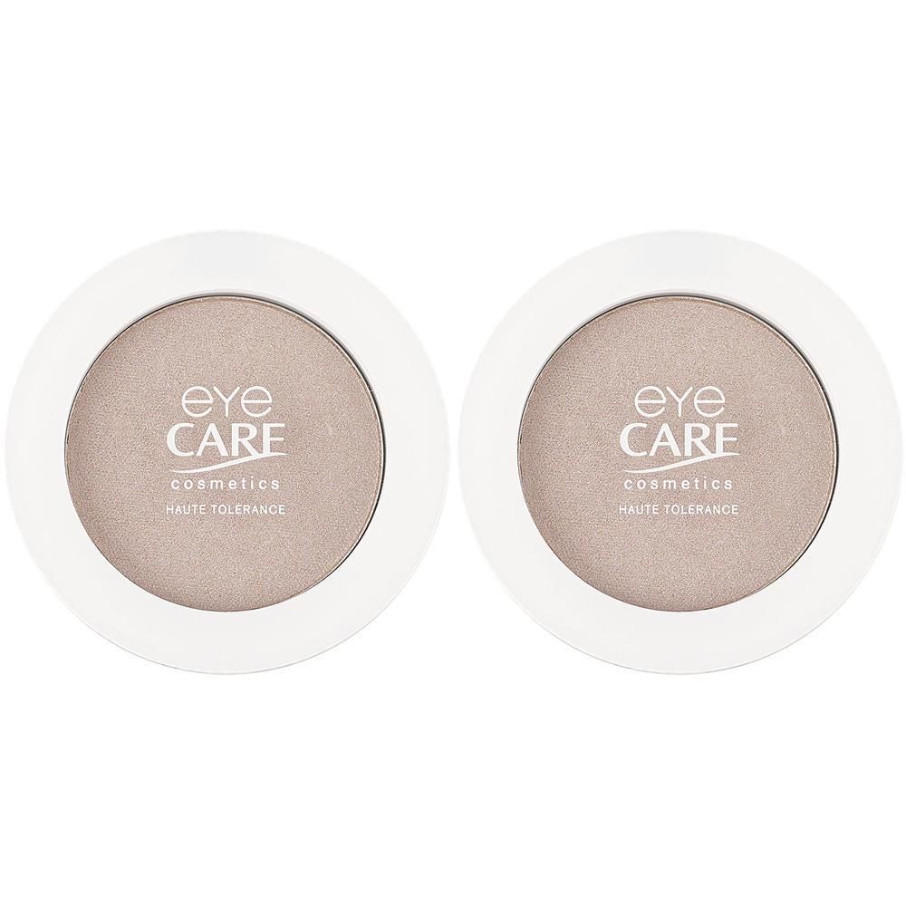 Zwei runde Lidschatten-Dosen mit dem Logo von EYE CARE cosmetics.