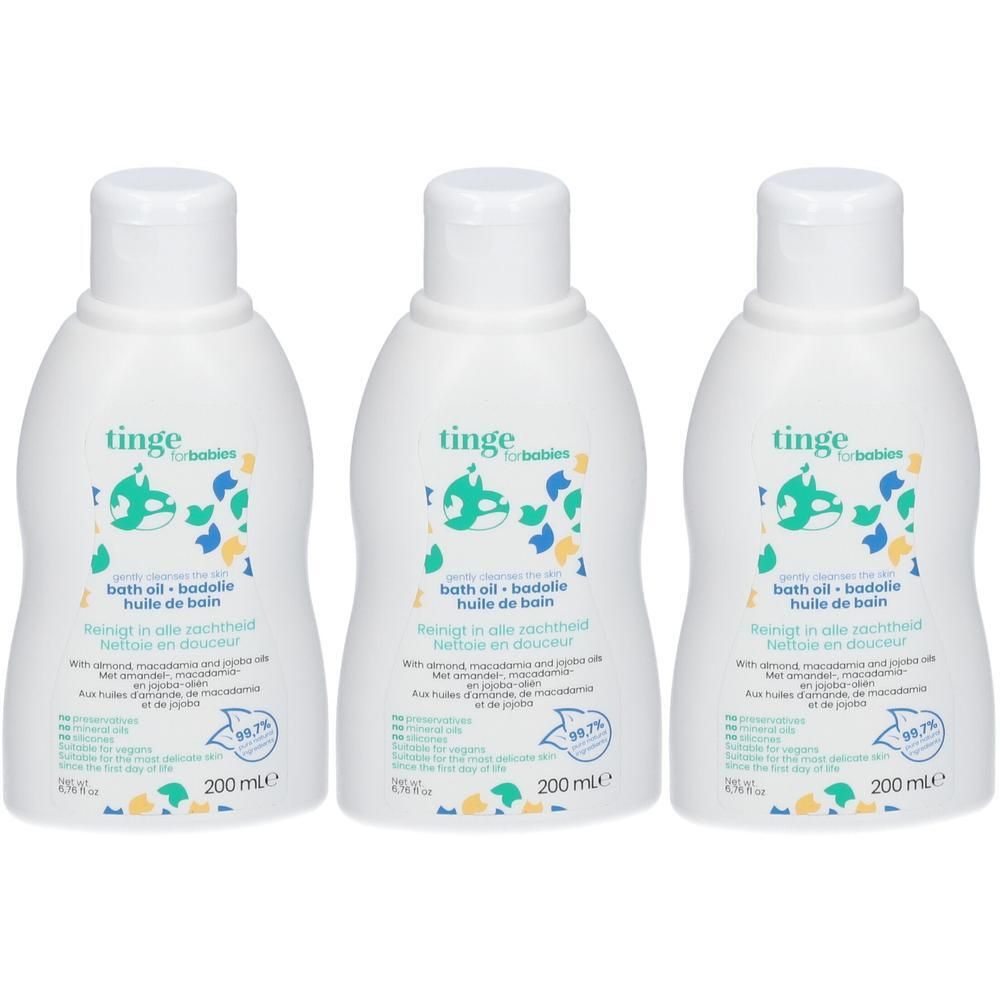 Trois flacons d'huile de bain Tinge pour bébés, avec une étiquette montrant un bébé dans une baignoire.
