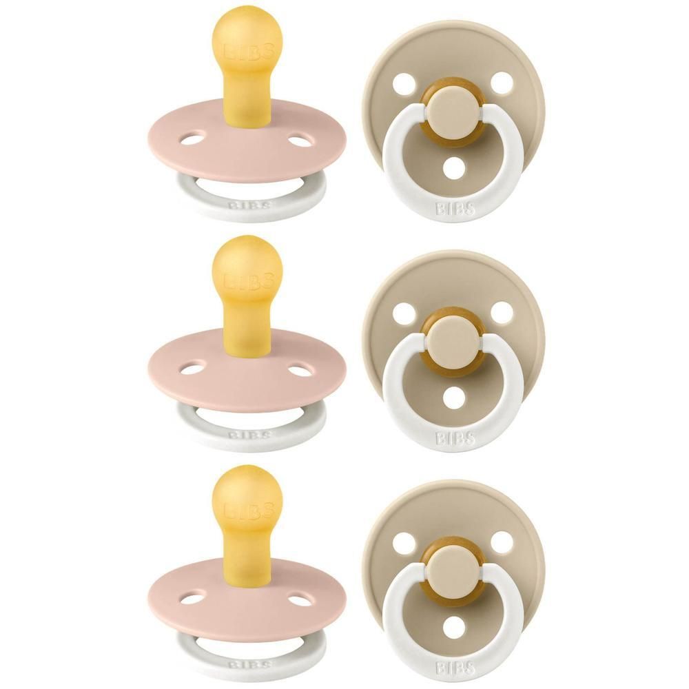 Trois paquets de sucettes BIBS Colour, taille 1, en rose et beige.