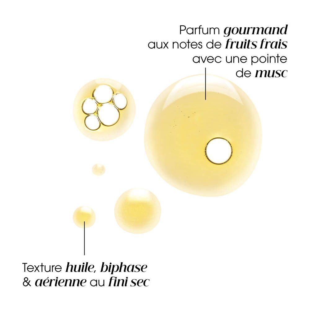 Gros plan sur deux flacons d'huile Klorane à la mangue.
