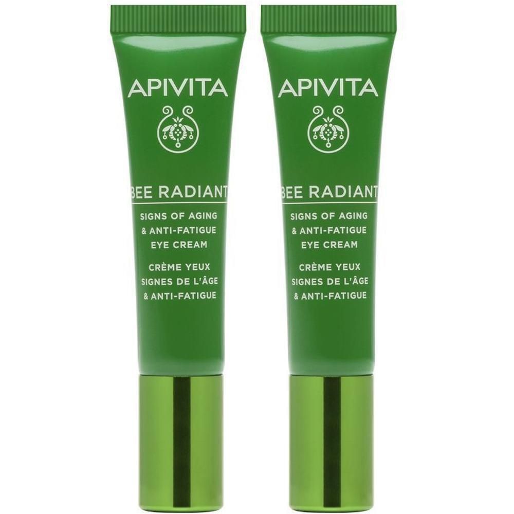 Deux tubes verts de crème contour des yeux Apivita Bee Radiant côte à côte.