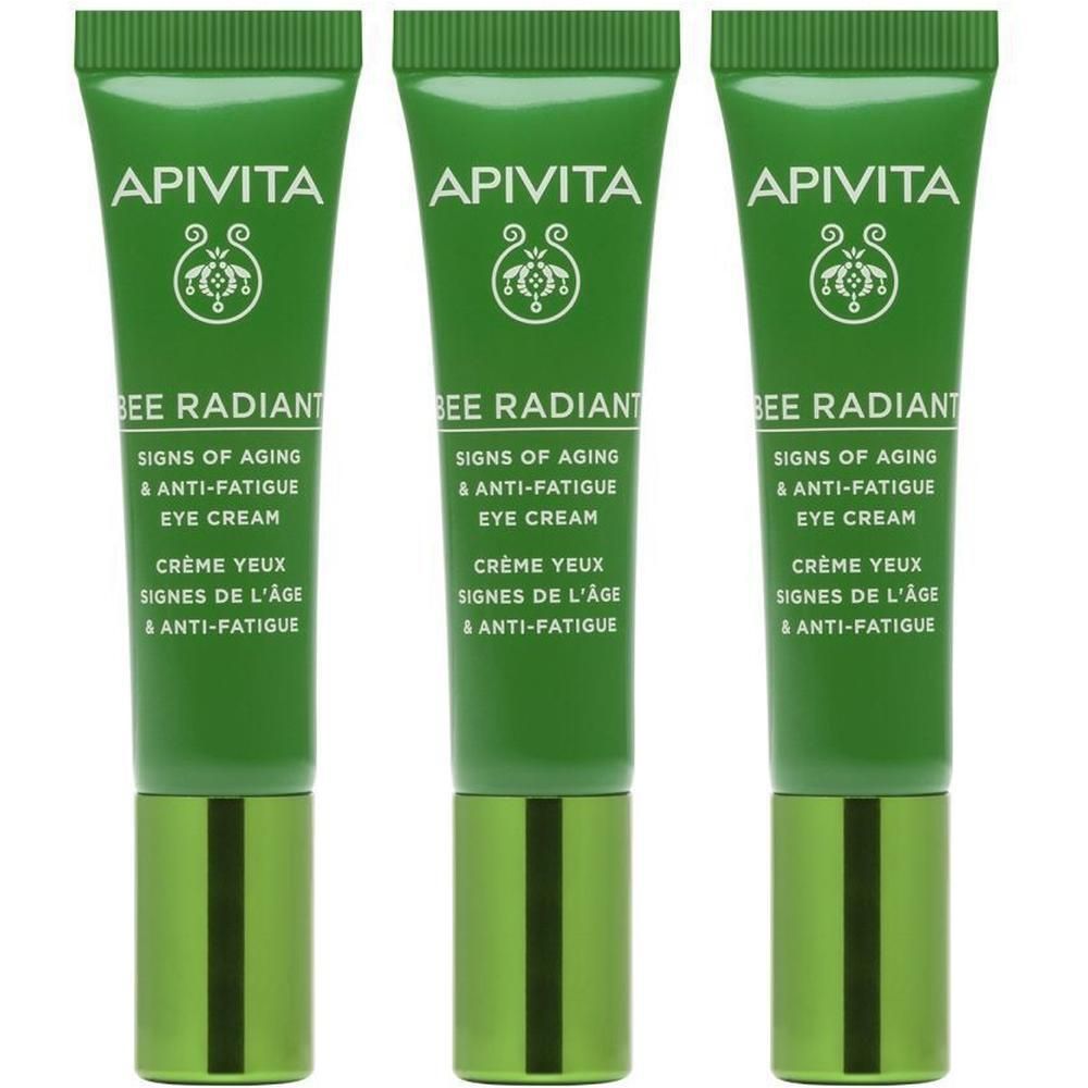 Trois tubes verts de crème pour les yeux avec inscription blanche et capuchon vert et noir.