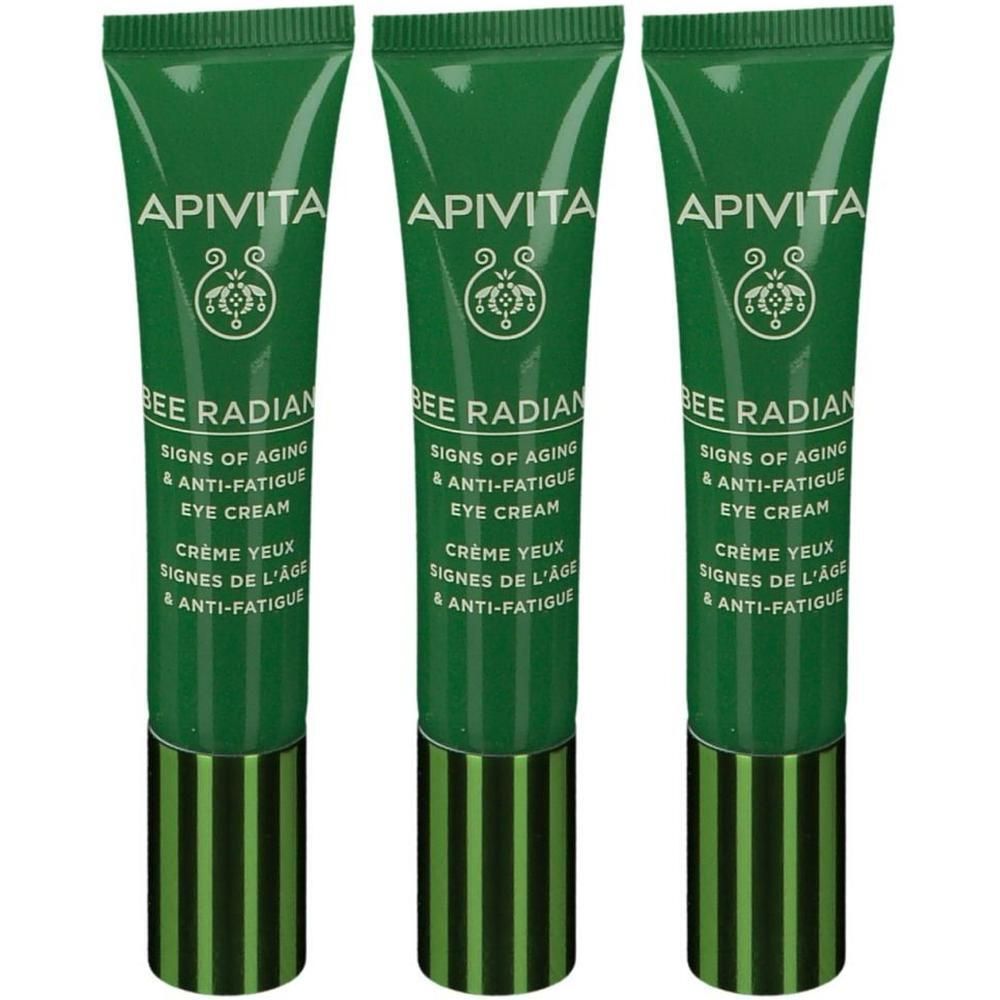 Trois tubes verts de crème pour les yeux avec inscription blanche et capuchon vert et noir.
