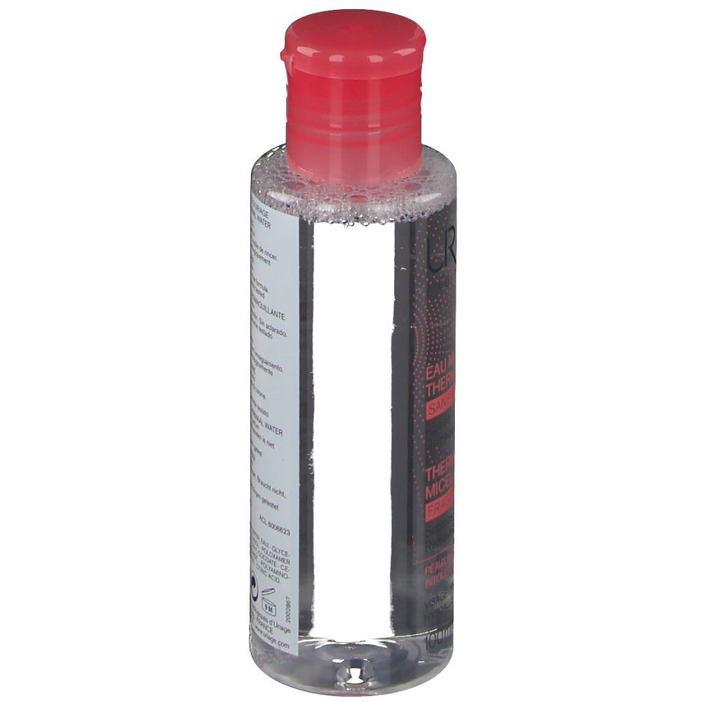 Flasche mit rotem Deckel. Etikett mit Produktinformationen. Barcode und Volumenangabe.