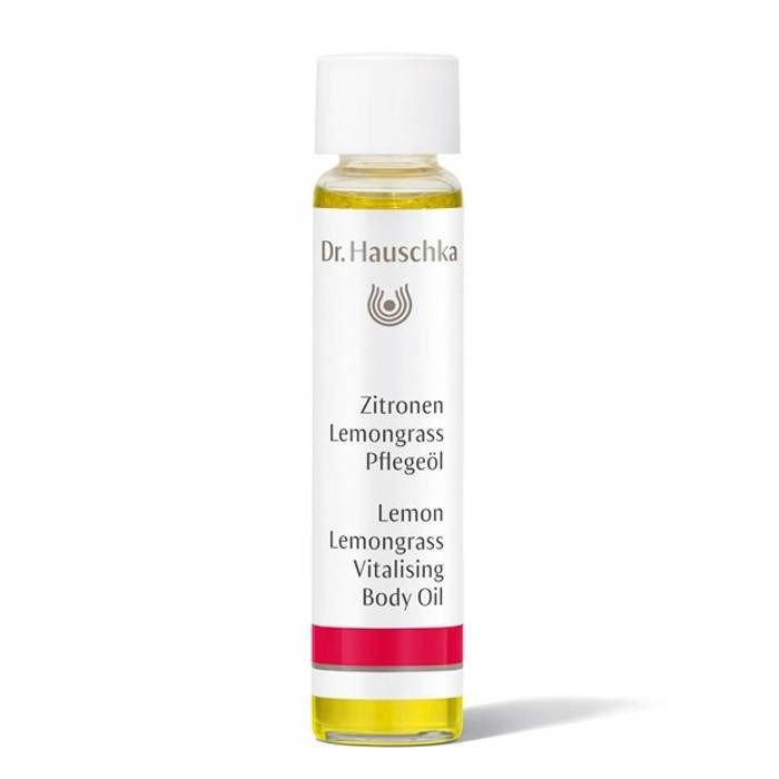 Körperölflasche mit weißem Deckel. Aufschrift: Dr. Hauschka, Zitrone, Lemongrass, Pflegeöl, Lemon, Lemongrass, Vitalising Body Oil.
