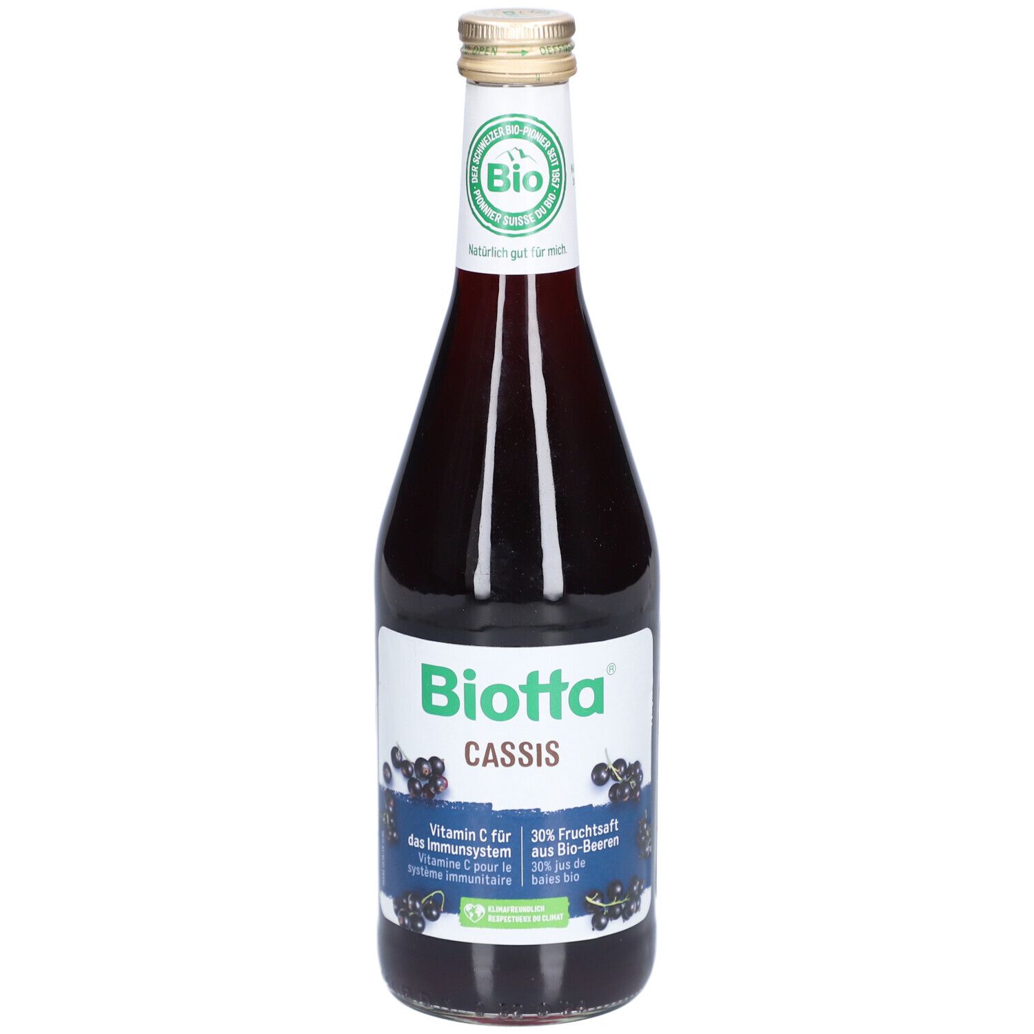 Glasflasche mit BIOTTA Cassis. Etikett mit Produktinformationen und Bio-Siegel. Schwarze Johannisbeeren abgebildet.