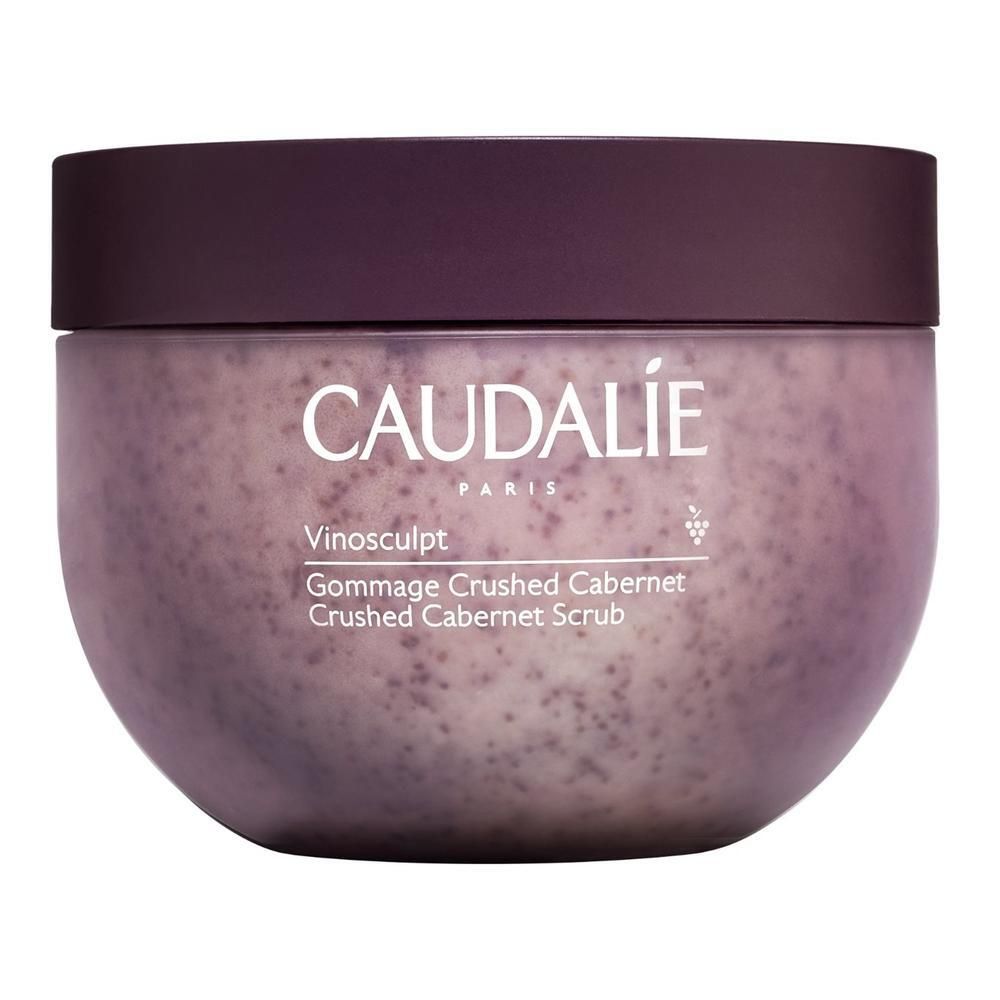 Pot rond avec couvercle. Inscription: Caudalie, Vinosculpt, Crushed Cabernet Scrub. Contenu visible.