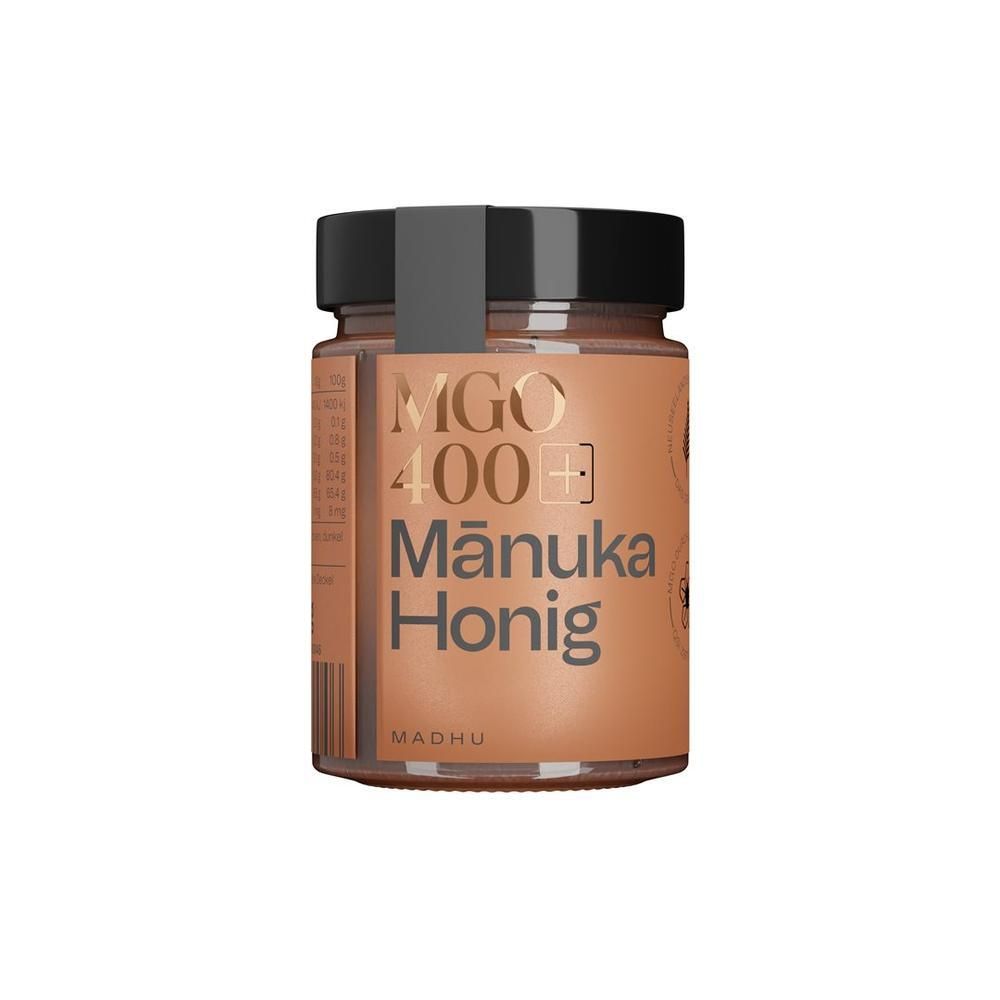 MADHU Manuka Honig MGO 400 Glas mit schwarzem Deckel und orangefarbenem Etikett.