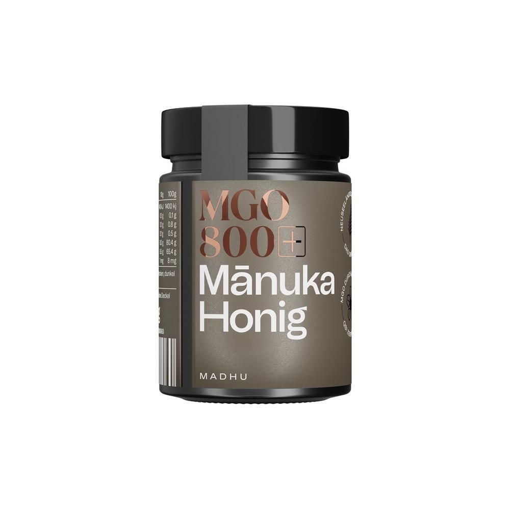Glas Manuka Honig MGO 800, Marke Madhu, mit schwarzem Etikett und Deckel.