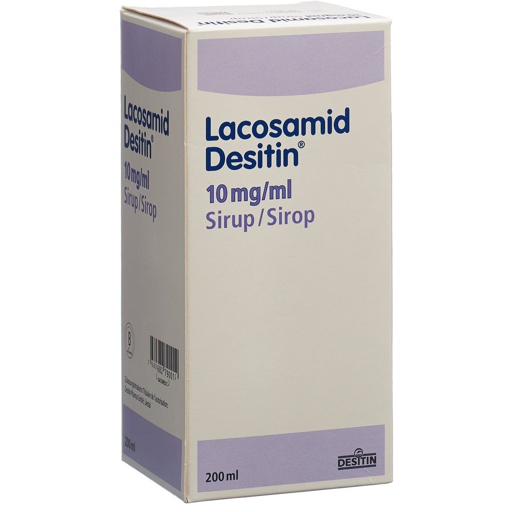 Emballage carton avec nom du produit: Lacosamid Desitin Sirup. Couleurs: blanc, beige, violet. Texte sur l'emballage.