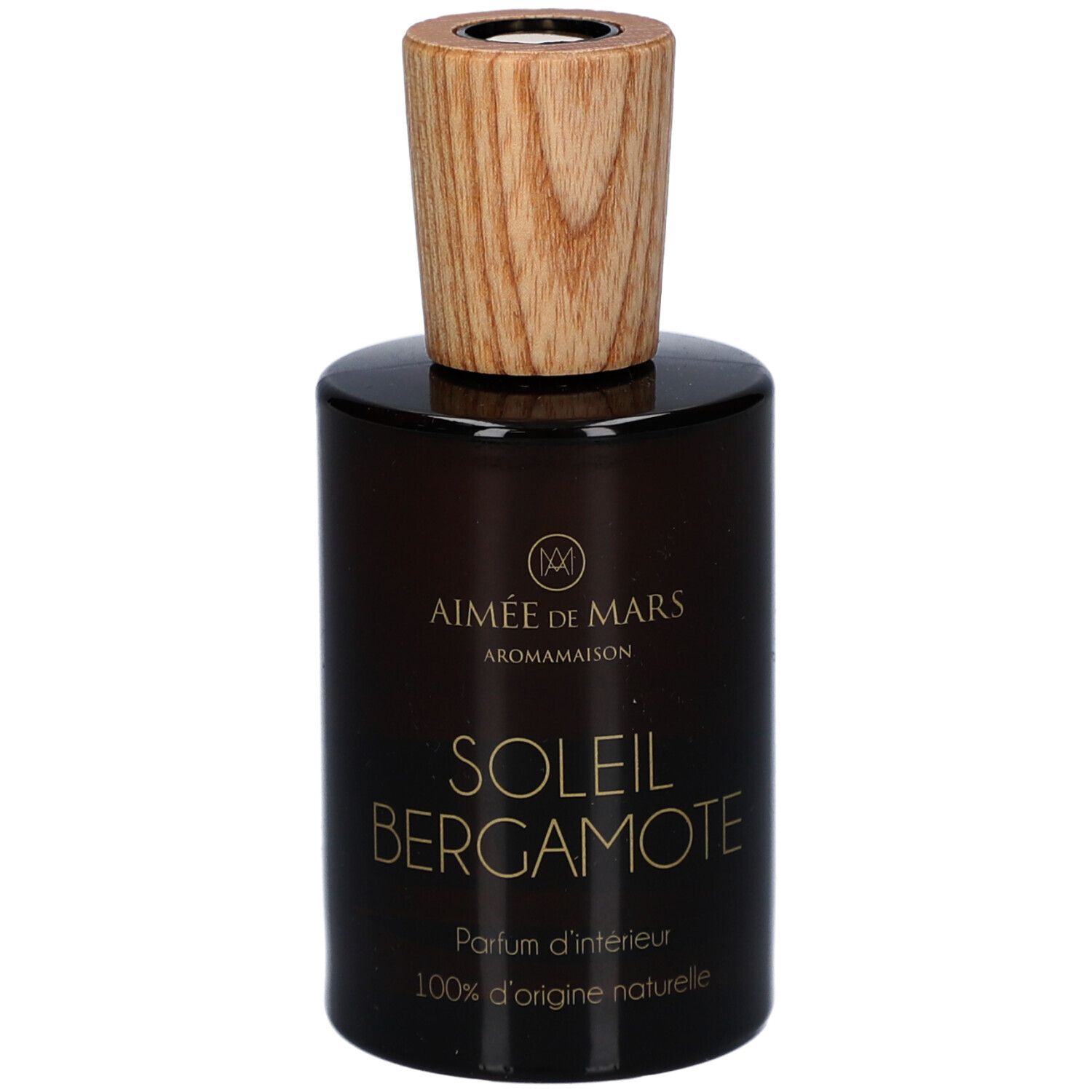 Flacon en verre brun avec bouchon en bois. Inscription : AIMEE DE MARS, SOLEIL BERGAMOTE, Parfum d'intérieur, 100% d'origine naturelle.