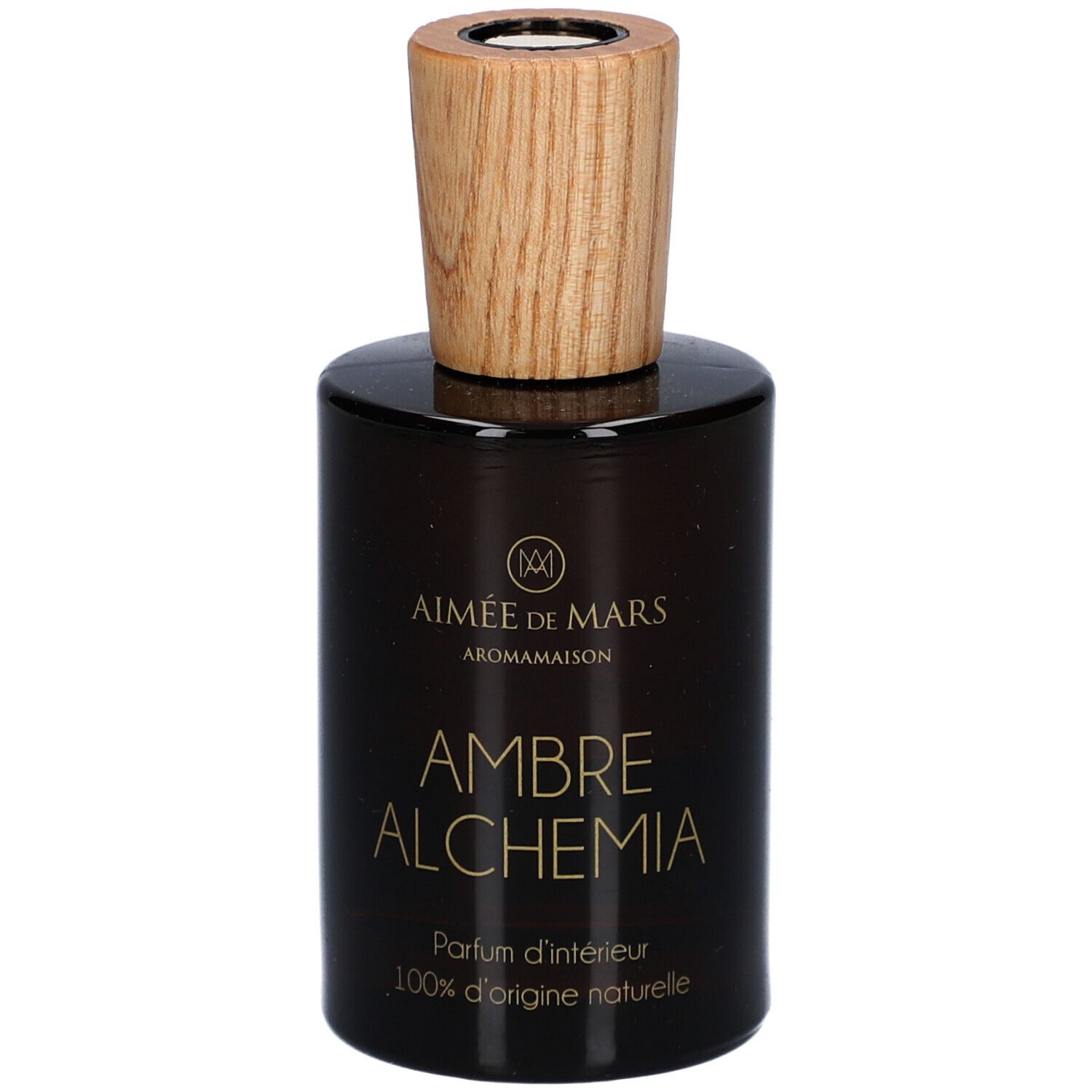 Flacon en verre brun avec bouchon en bois. Inscription: AMBRE ALCHEMIA, Parfum d'intérieur, 100% d'origine naturelle. Marque: Aimée de Mars.