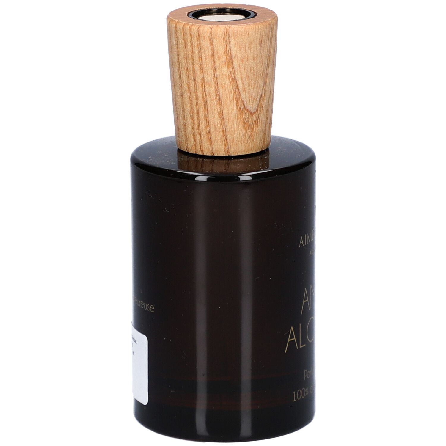 Flacon en verre brun avec bouchon en bois. Étiquette sur le côté. Marque: Aimée de Mars. Nom du produit: AMBRE ALCHEMIA.