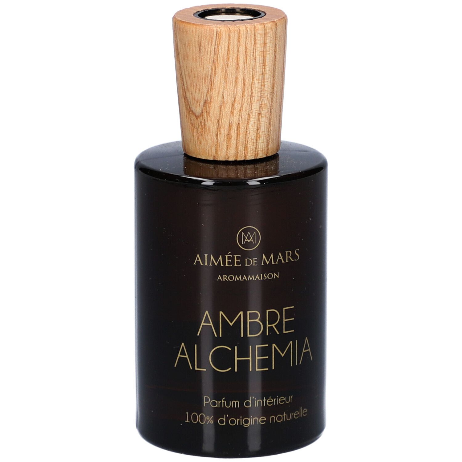Flacon en verre brun avec bouchon en bois. Inscription: AMBRE ALCHEMIA, Parfum d'intérieur, 100% d'origine naturelle. Marque: Aimée de Mars.