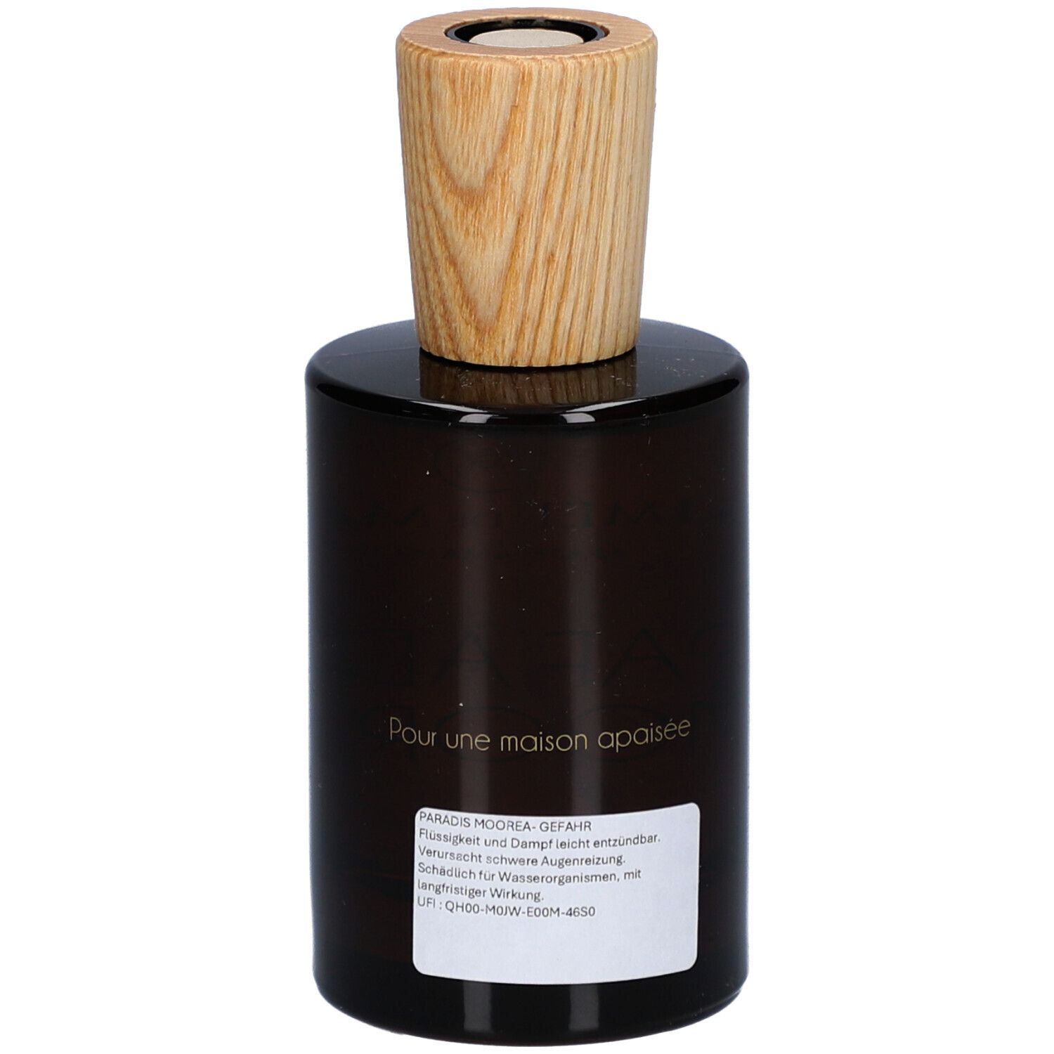 Braune Glasflasche mit Holzverschluss. Aufkleber mit Text. Aufschrift: Pour une maison apaisée.