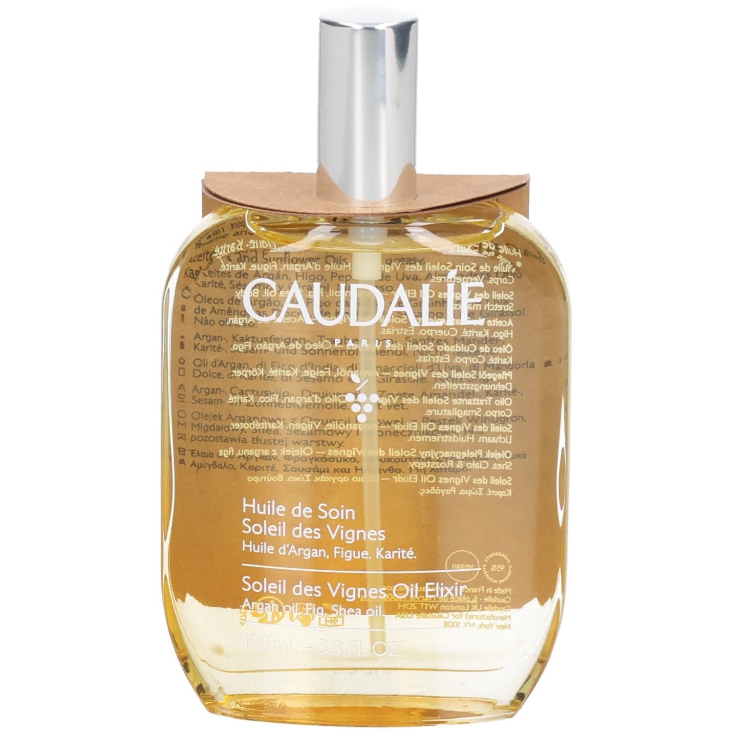 Flacon en verre d'huile dorée. Inscription CAUDALIE, Huile de Soin. Vaporisateur argenté, étiquette marron.