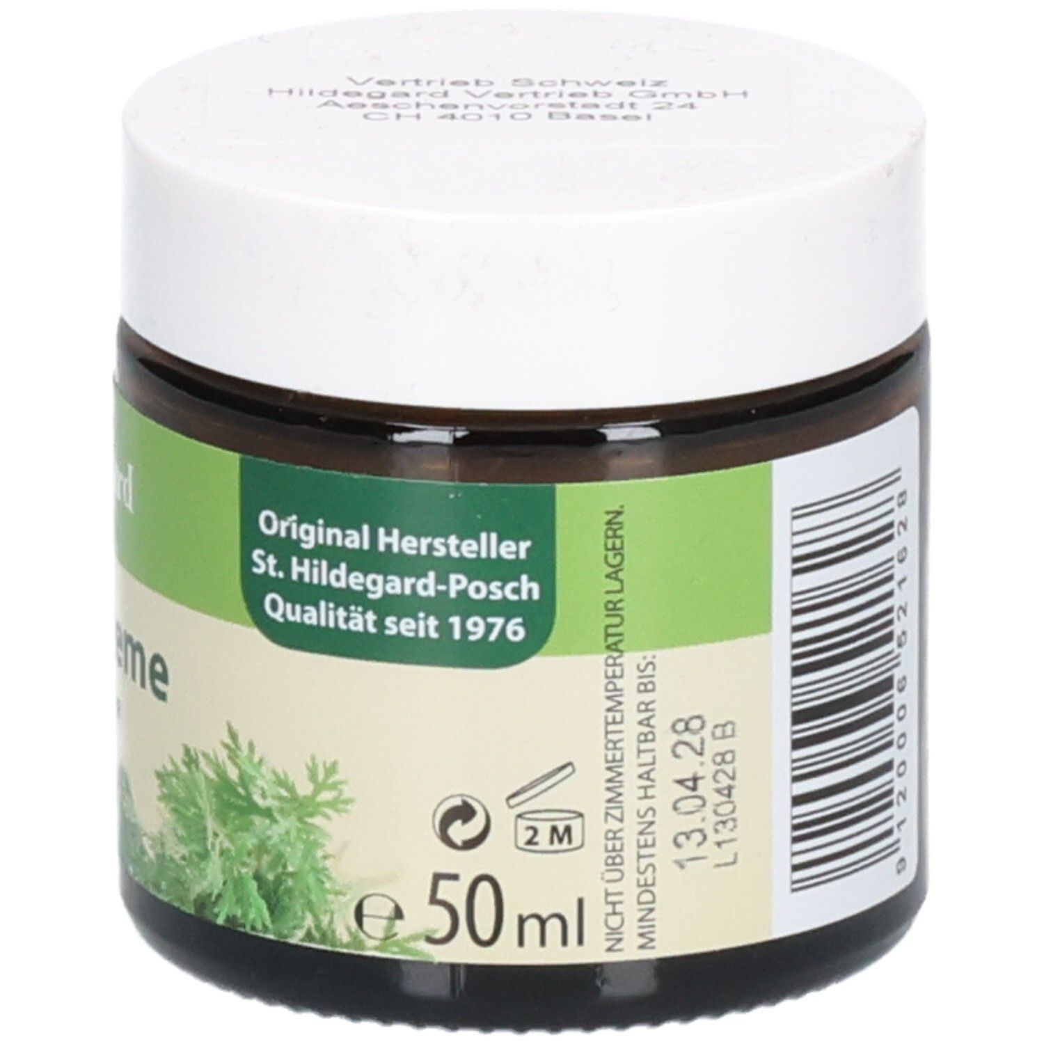 Pot en verre brun avec couvercle blanc. Étiquette avec texte et symboles. Texte: Hildegard von Bingen, Wermutcreme, Originalrezeptur, POSCH Original, 50ml.