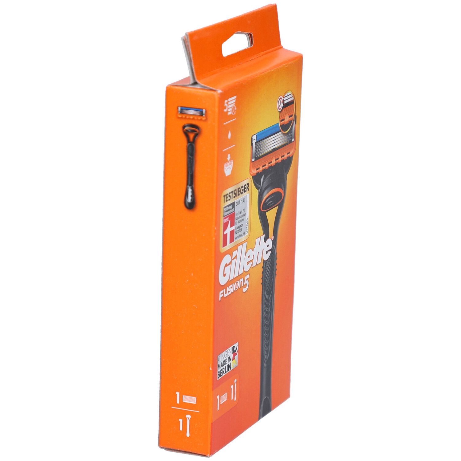 Orangefarbene Verpackung mit Rasierer-Silhouette. Text: Gillette Fusion5, TestSieger. Rasierer-Abbildung.