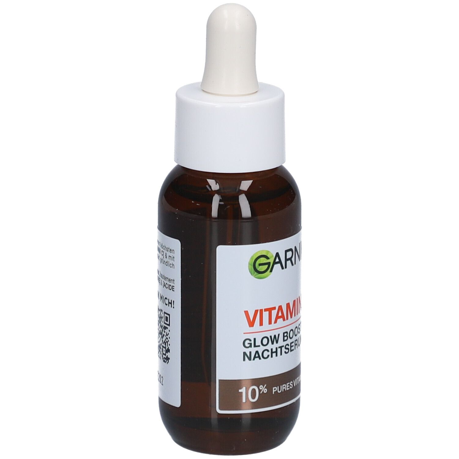 Flacon en verre brun avec bouchon blanc et pipette. Étiquette avec nom du produit et indication de contenu. Marque Garnier visible.