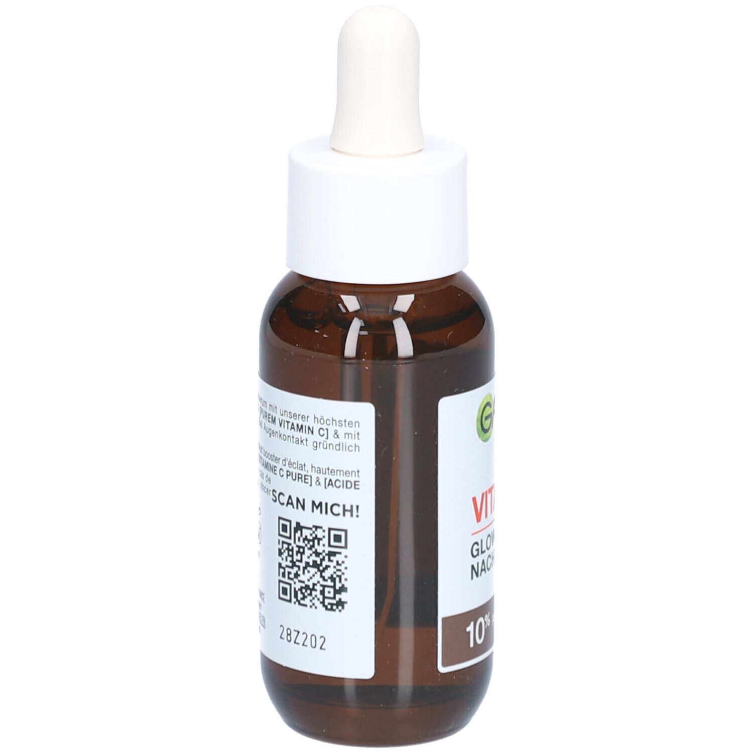 Flacon en verre brun avec bouchon blanc et pipette. Étiquette avec texte et indication de contenu. Marque Garnier visible.