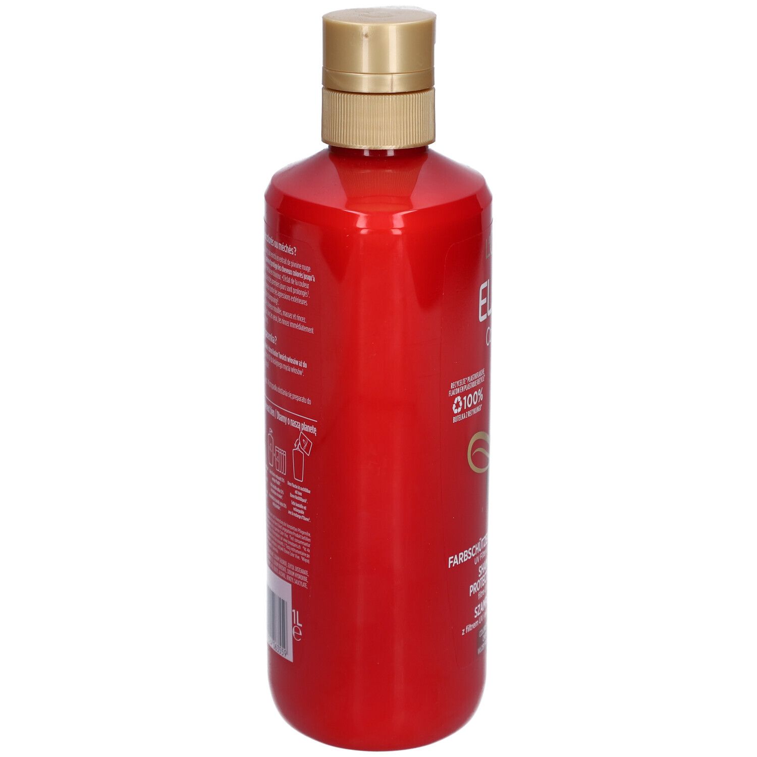 Rote Shampoo-Flasche, Seitenansicht. Goldfarbener Deckel. Text und Logos auf dem Etikett.