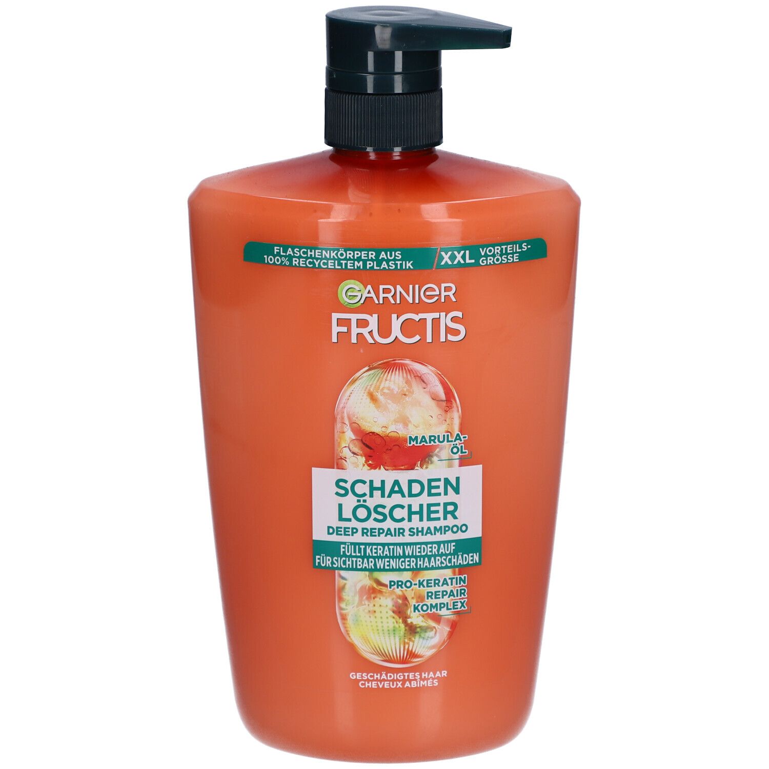 Flacon de shampooing orange avec pompe noire. Inscriptions: Garnier Fructis, Schadenlöscher, huile de marula.