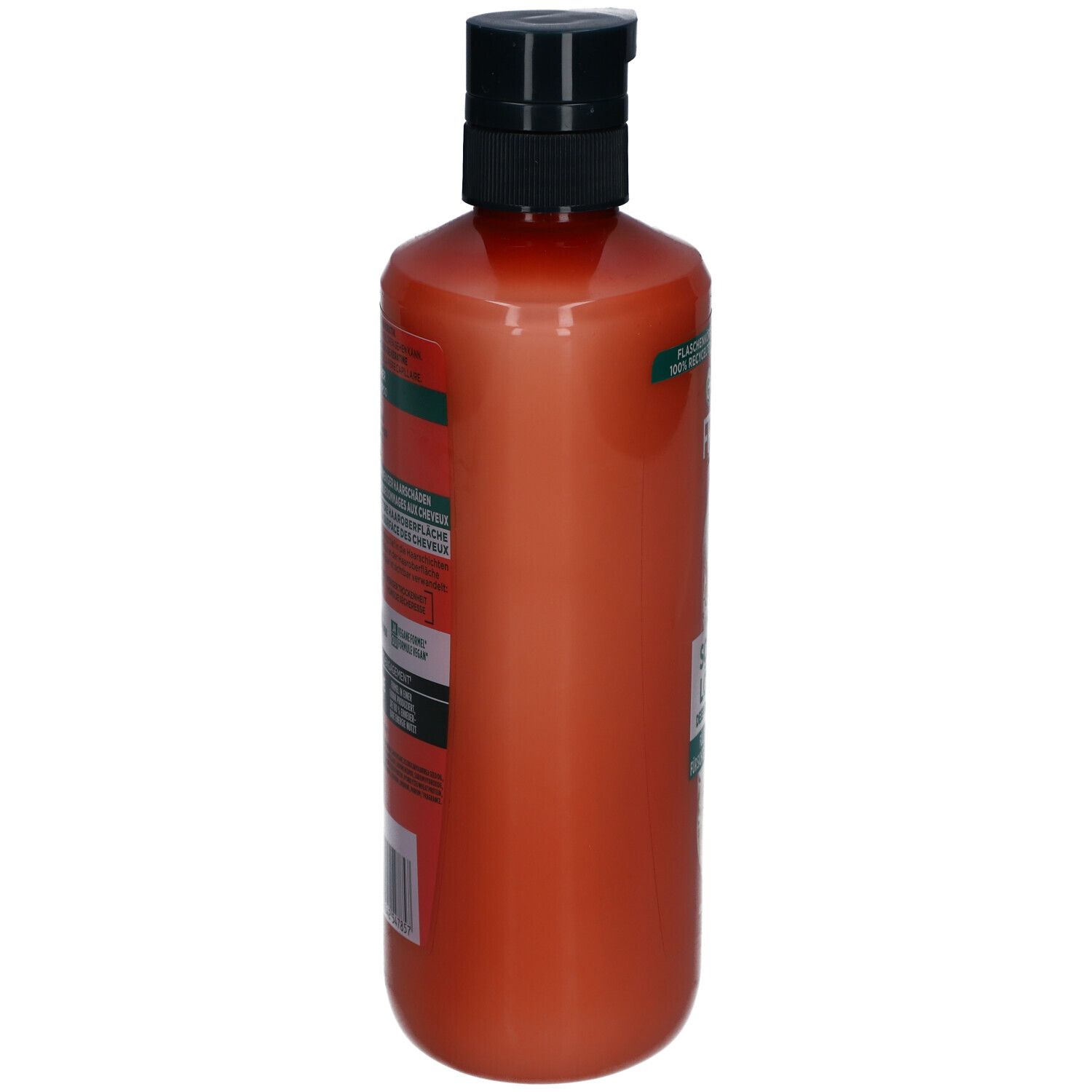 Flacon de shampooing orange, vue latérale. Pompe noire. Étiquettes avec texte.