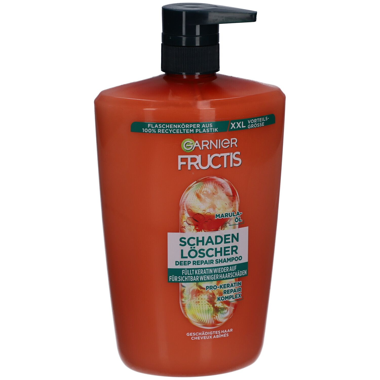 Flacon de shampooing orange avec pompe noire. Inscriptions: Garnier Fructis, Schadenlöscher, huile de marula.
