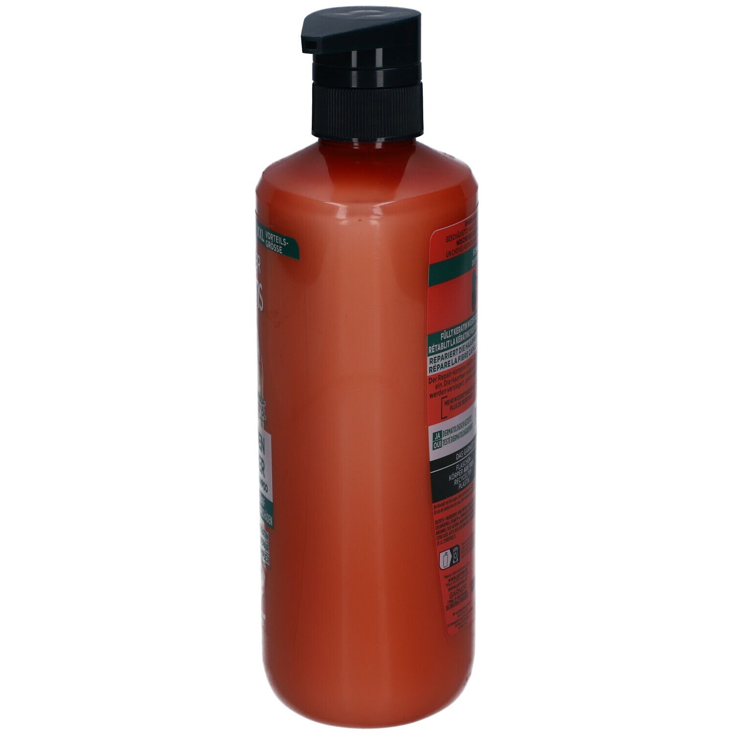 Flacon de shampooing orange, vue latérale. Pompe noire. Étiquettes avec texte.