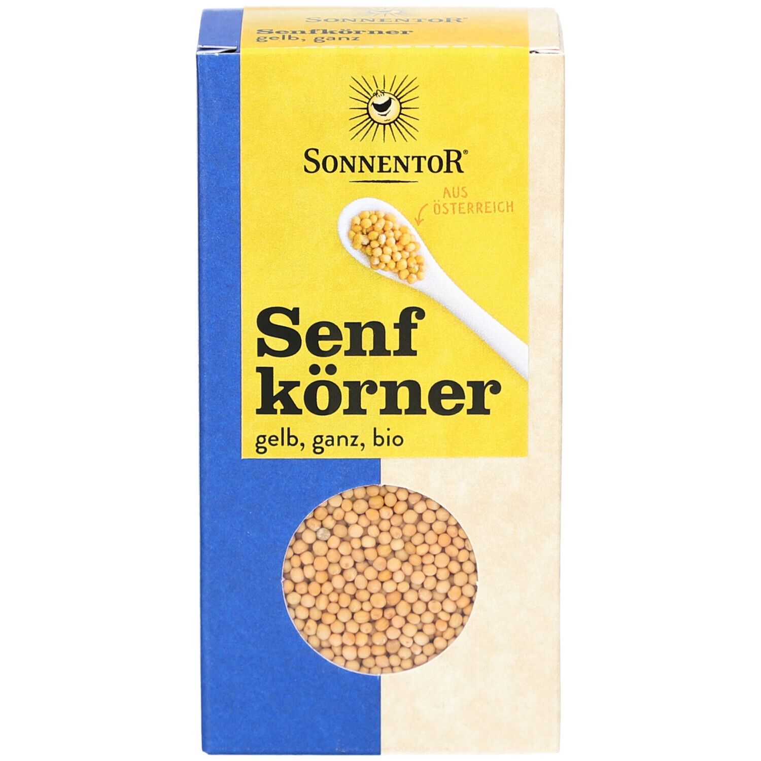 Boîte de graines de moutarde. Inscription : SONNENTOR Senfkörner gelb ganz BIO. Fenêtre avec graines de moutarde.