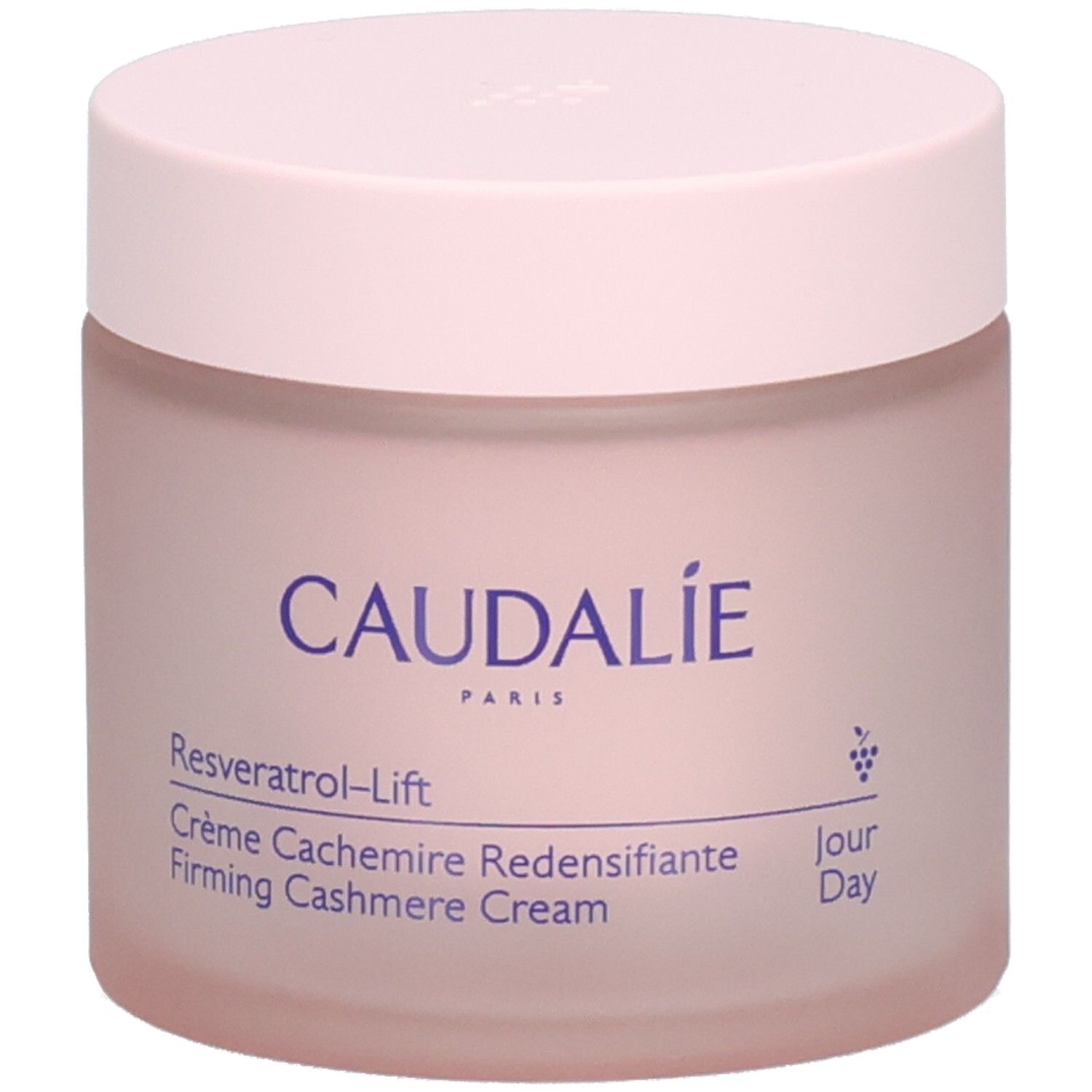 Pot de crème rose avec couvercle. Inscription: Caudalie, Resveratrol-Lift, Crème Cachemire Redensifiante.