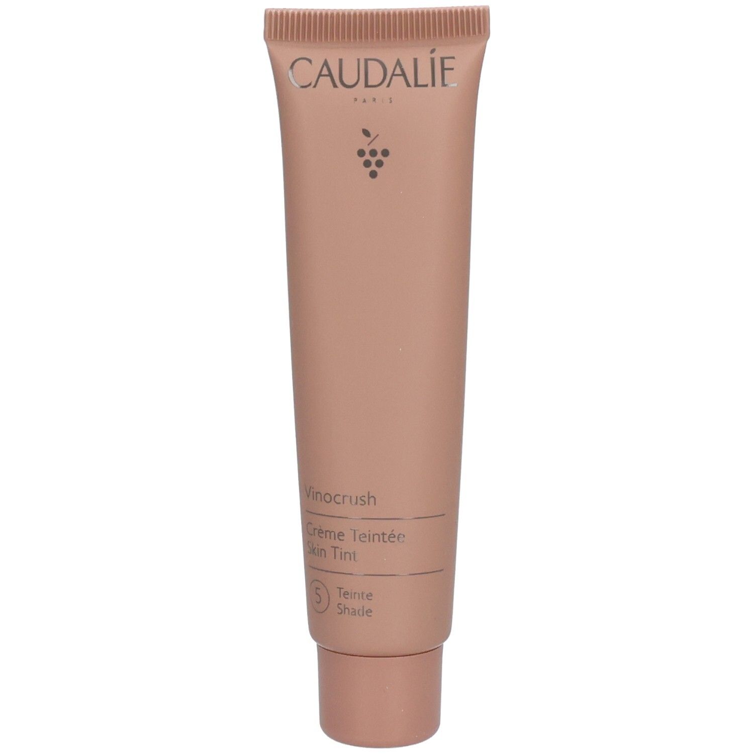 Tube de crème rose. Inscription: CAUDALIE, Vinocrush, Crème Teintée, 5 Teinte, Shade.