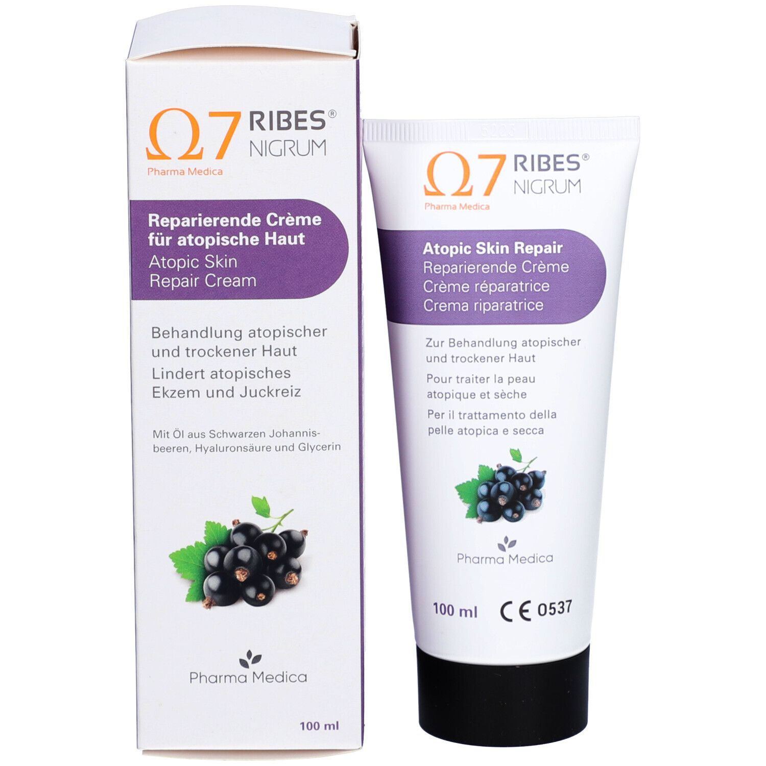 Produktverpackung mit Tube und Karton. Tube: Atopic Skin Repair. Karton: Schwarze Johannisbeeren, Text, Logo.