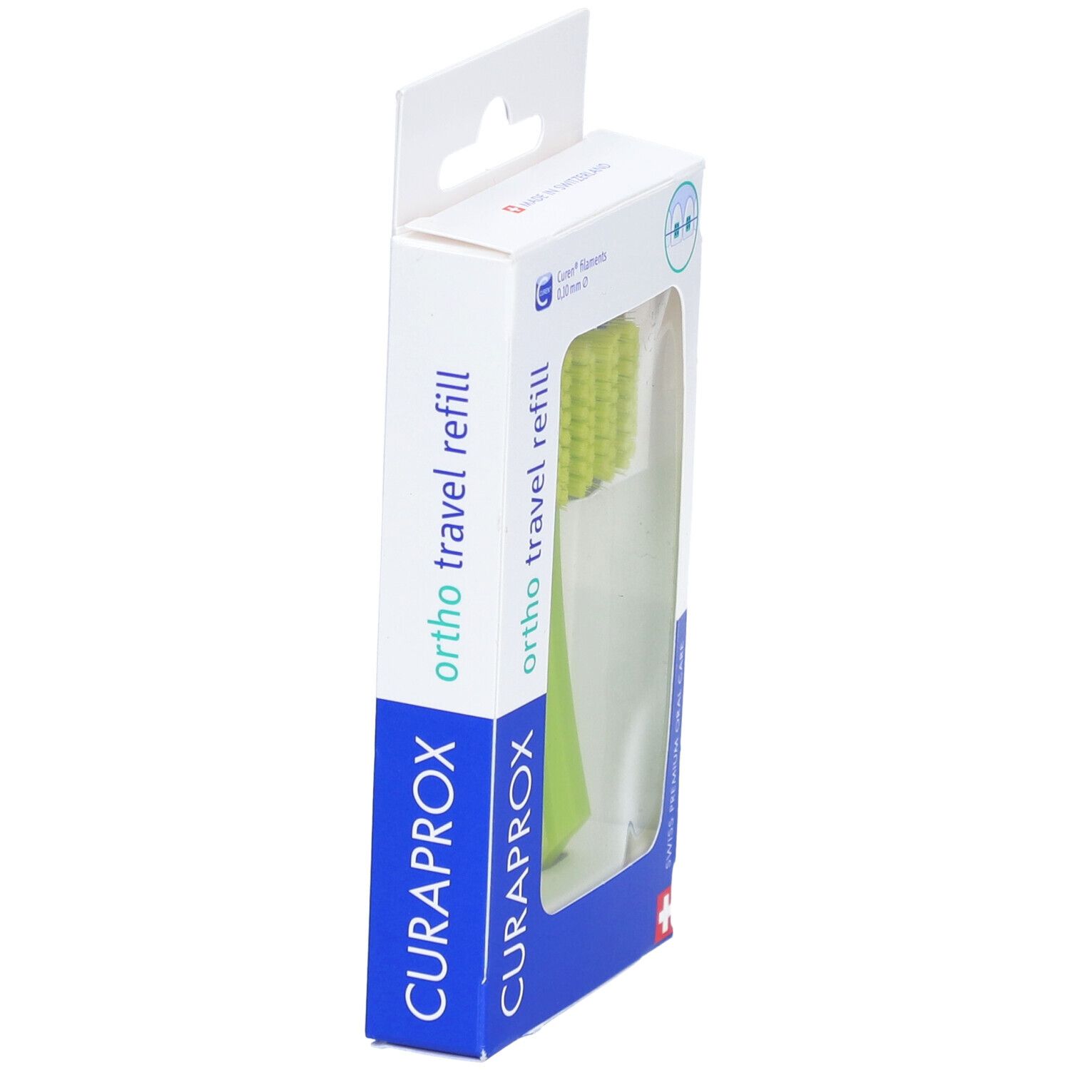 Verpackung mit einer grünen Zahnbürstenkopf. "CURAPROX" und "ortho travel refill" sind sichtbar.