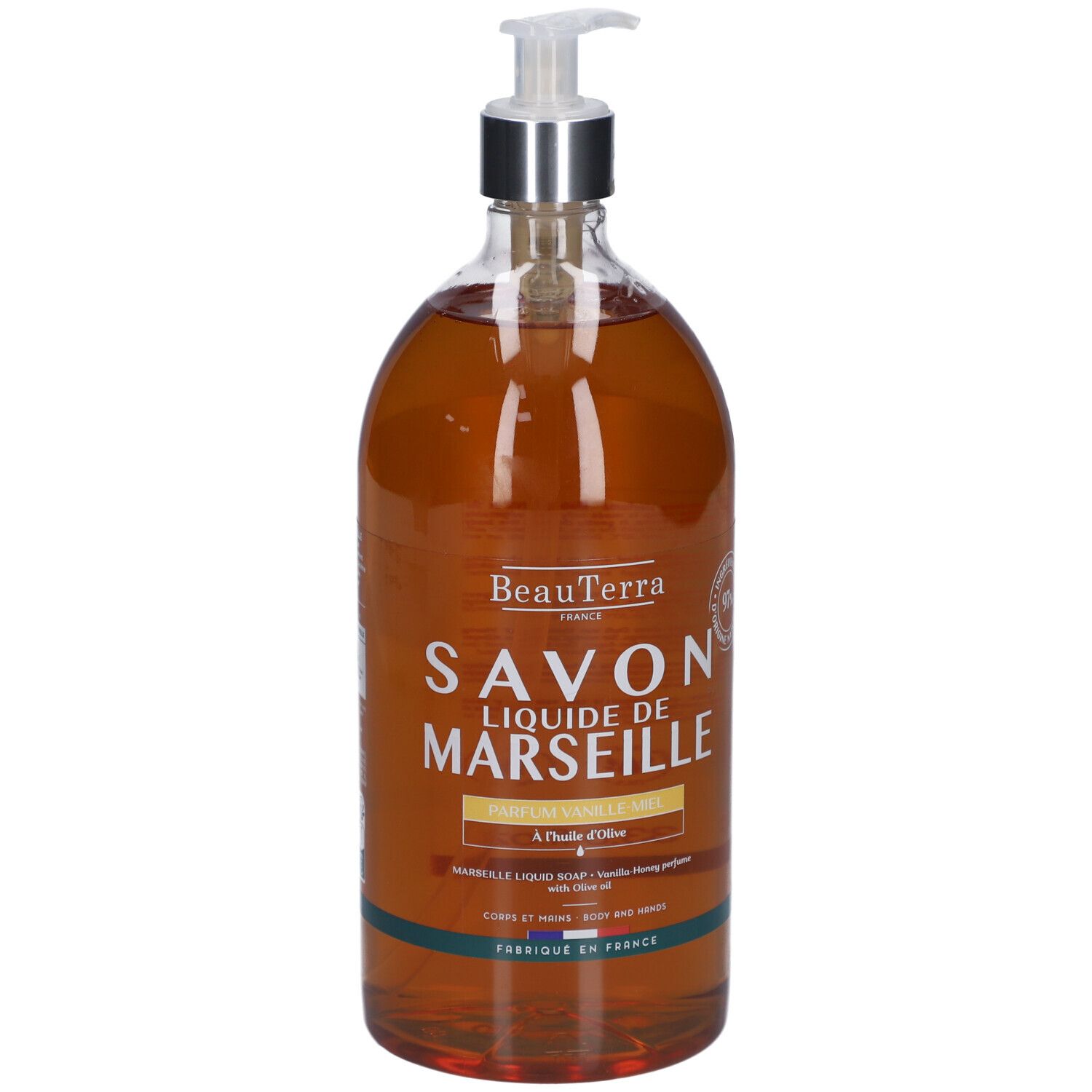 Savon liquide Beauterra de Marseille, parfum vanille-miel. Bouteille transparente avec pompe doseuse. Étiquette produit avec texte.